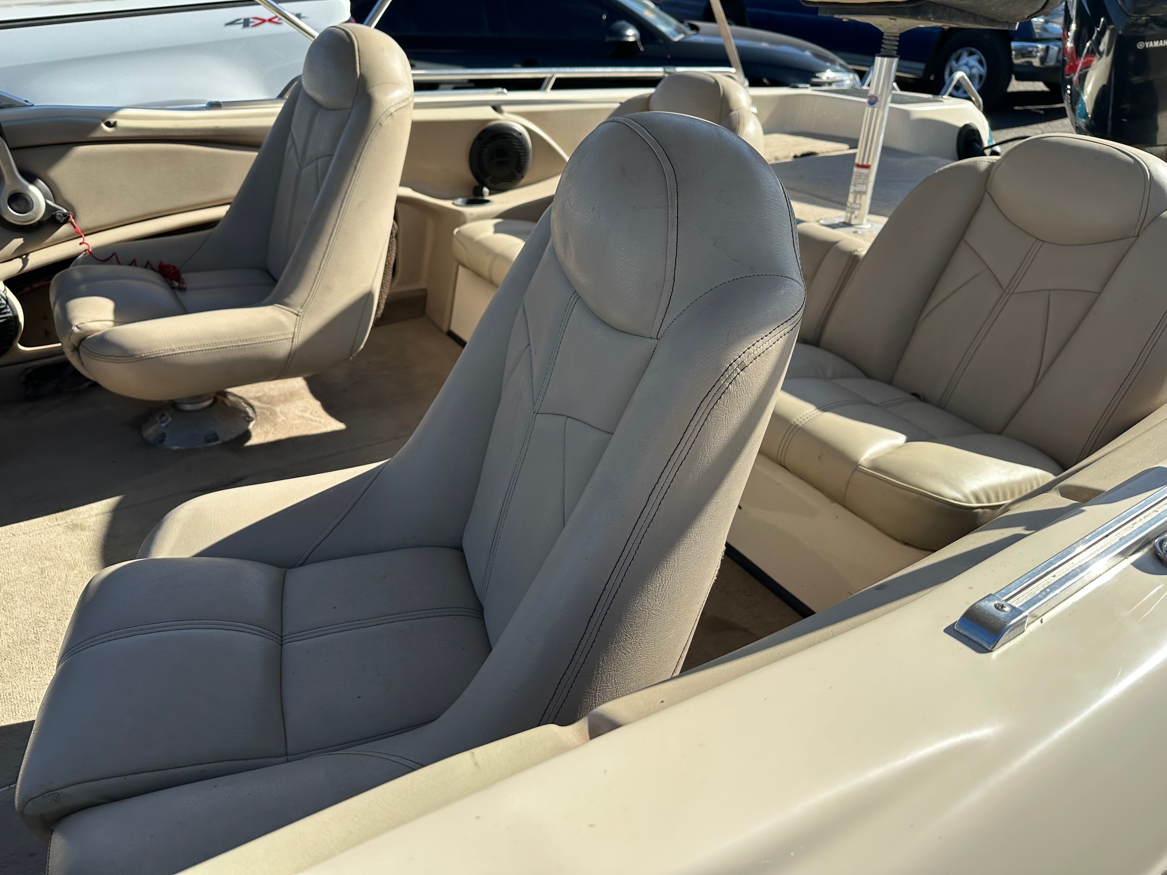 Interior of a 2008 Skeeter SL 210 with beige leather seats and modern design.