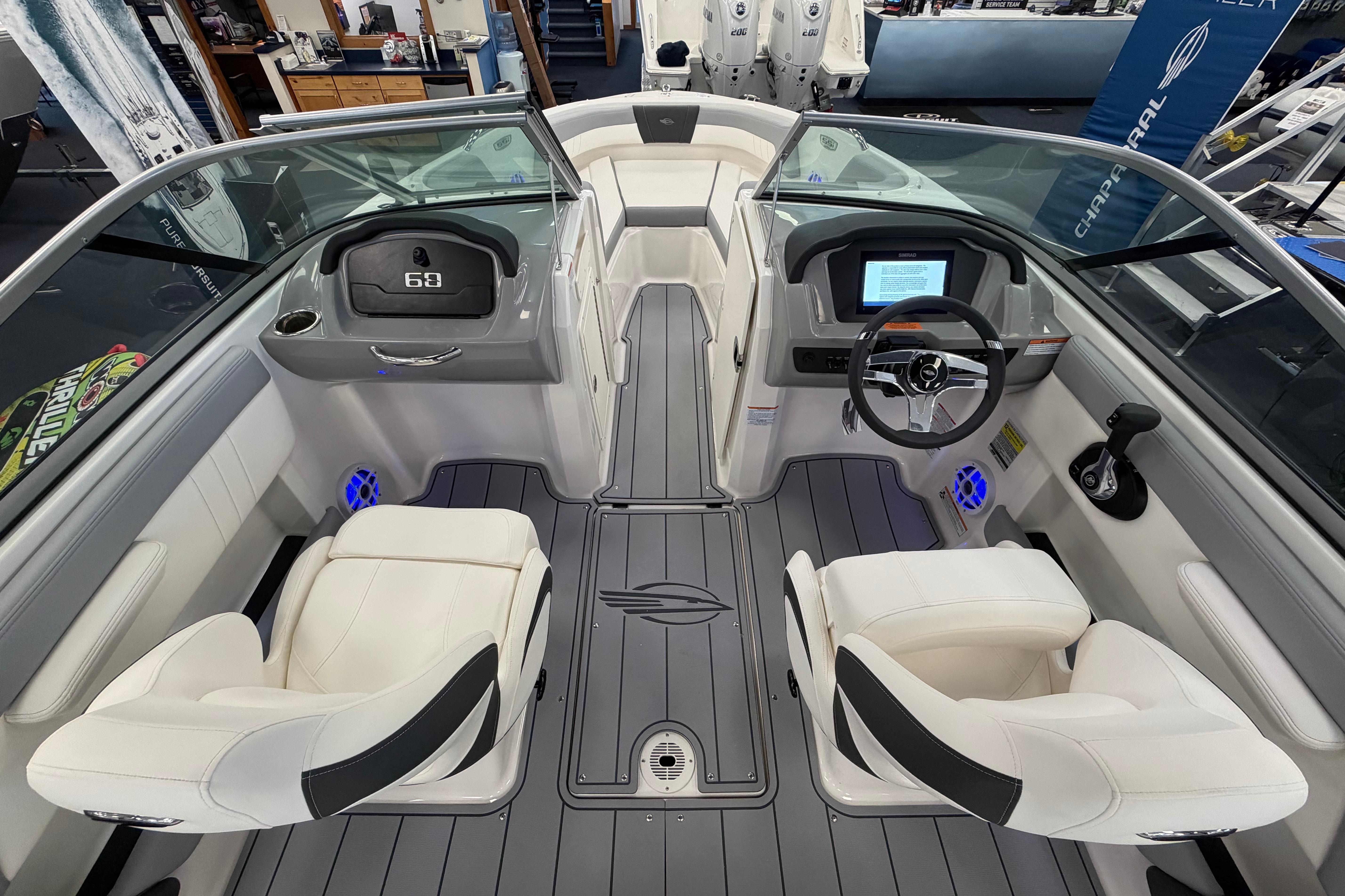 Interior view of 2025 Chaparral 21 SSi OB boat, featuring modern dashboard and seating.