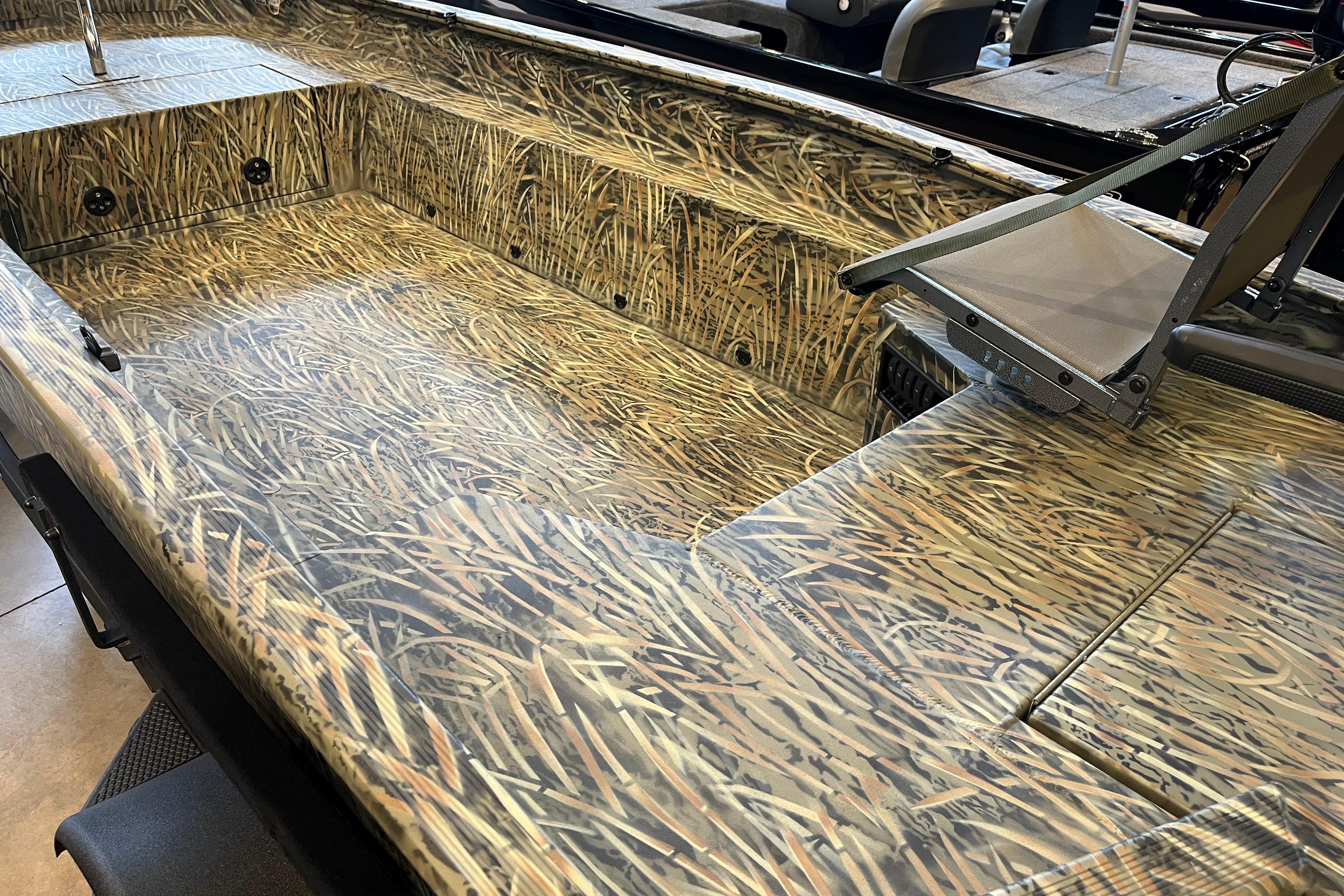 2026 Tracker Grizzly 1654 T Sportsman boat interior with camouflage design.