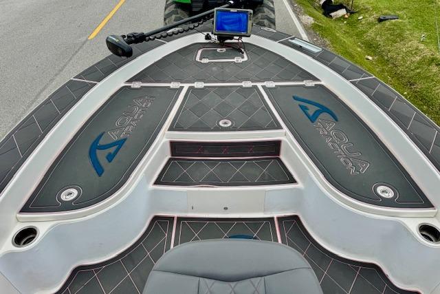2015 Robalo 226 Cayman boat deck with Aqua Traction flooring and navigation equipment.