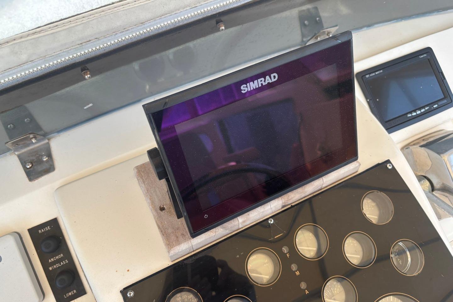 Simrad navigation system on 1993 Ocean Yachts 44 Aft Cabin dashboard.