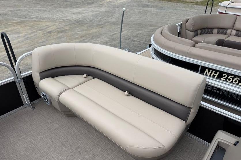 2025 Sun Tracker Party Barge 16 DLX with beige seating on a pontoon boat.