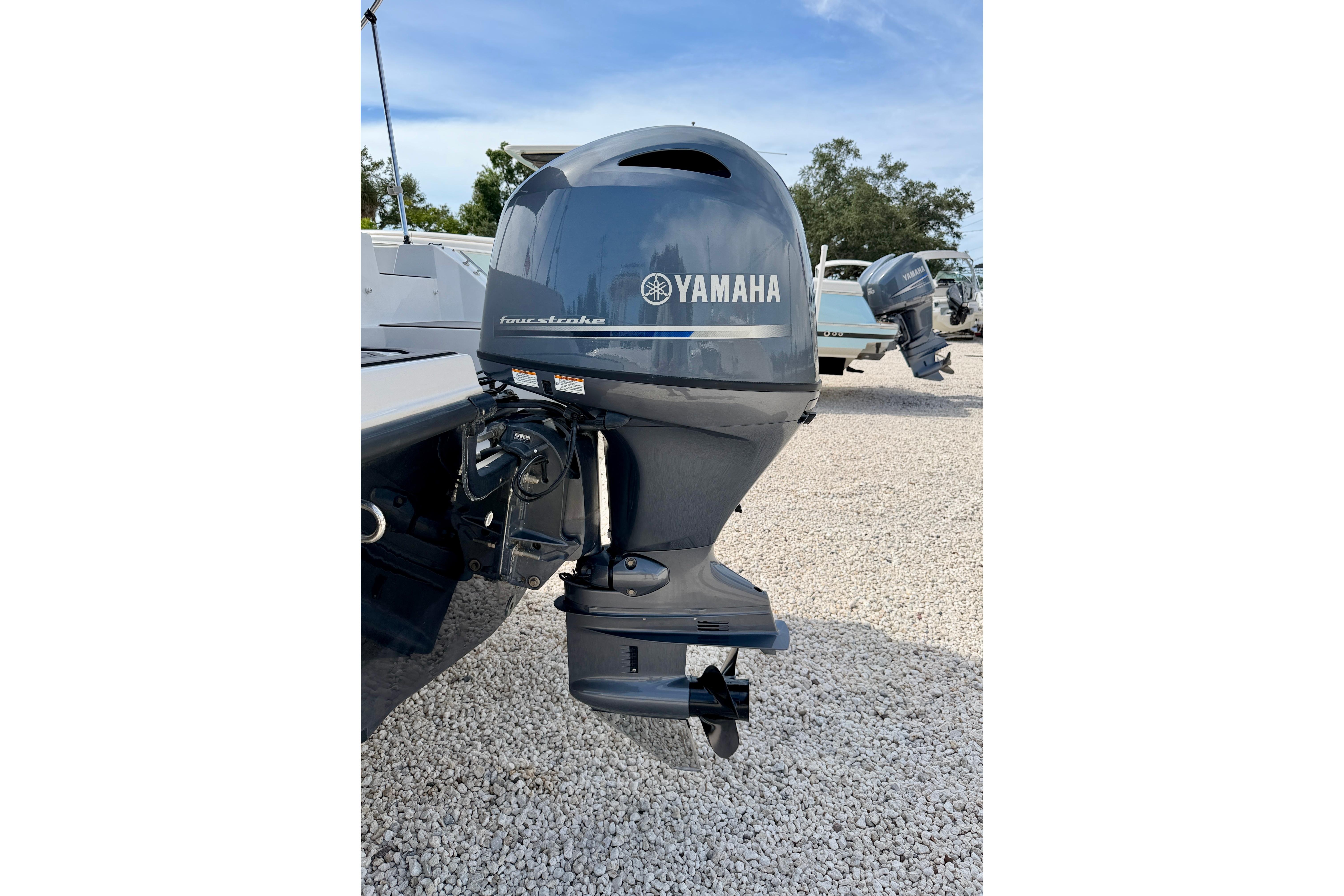2021 Starcraft SVX 191 OB with Yamaha four-stroke outboard motor on gravel surface.