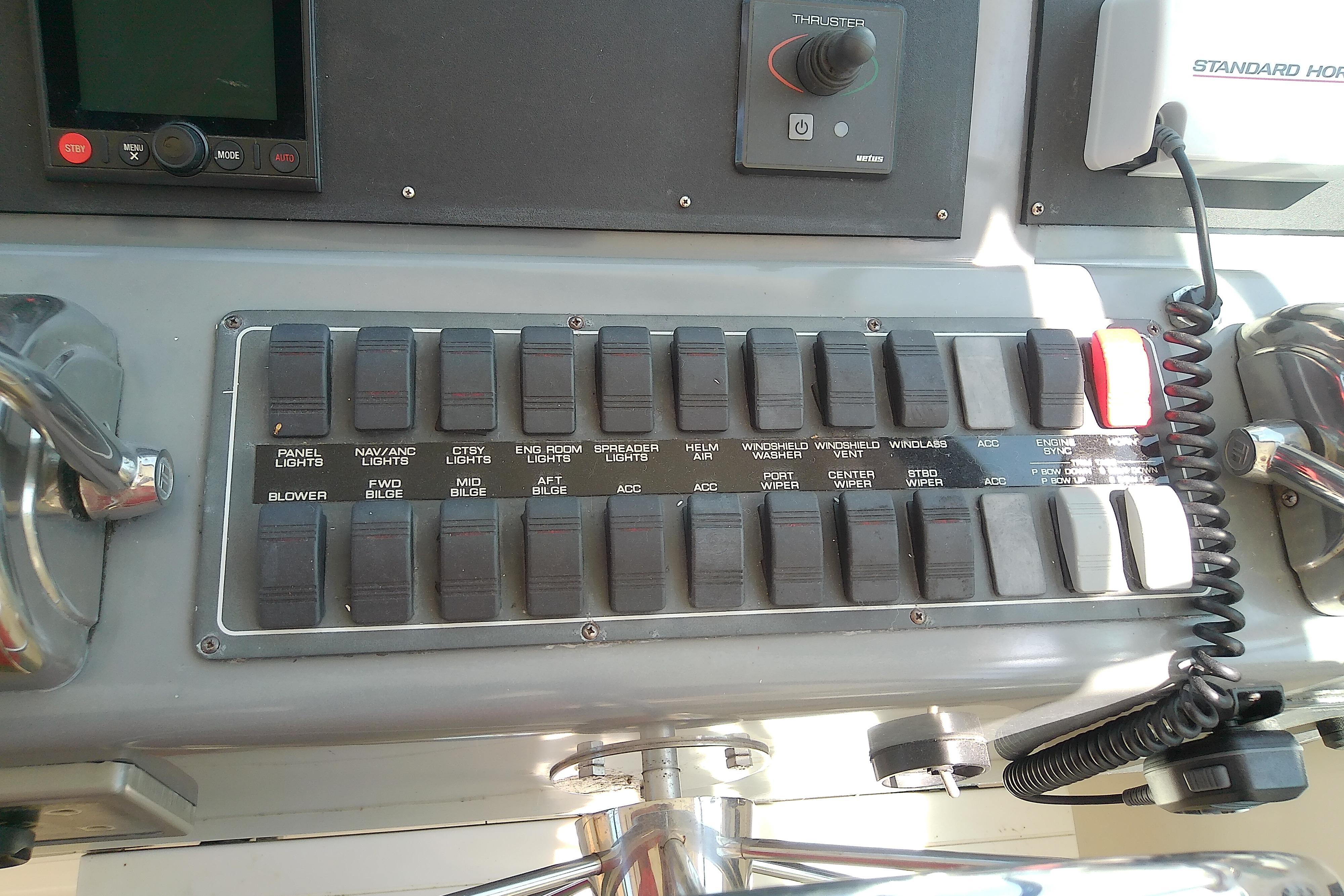 Control panel of a 2000 Tiara Yachts 4100 Open with labeled switches and controls.
