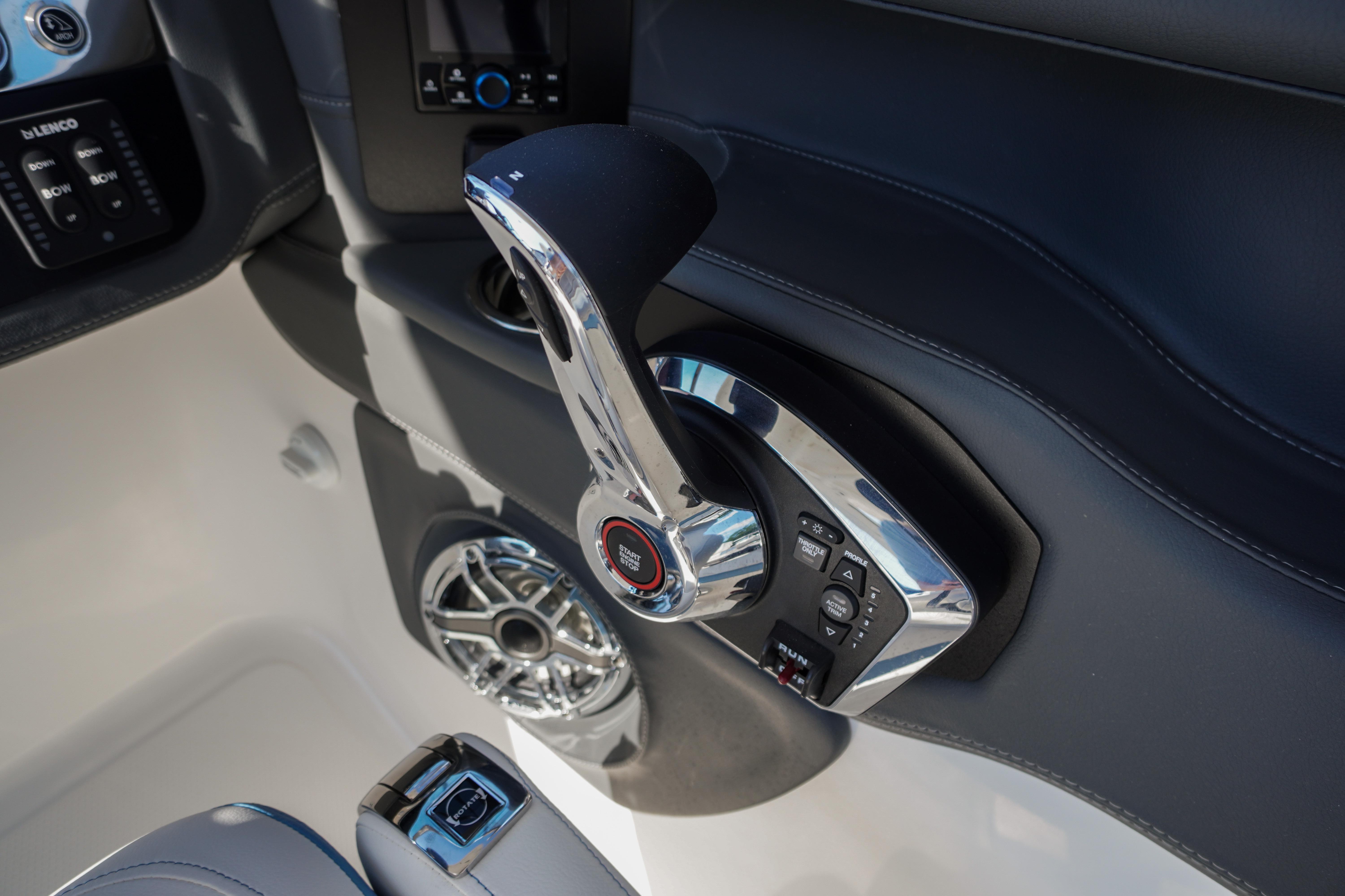 Control panel of 2026 Chaparral 270 OSX boat with sleek chrome throttle.