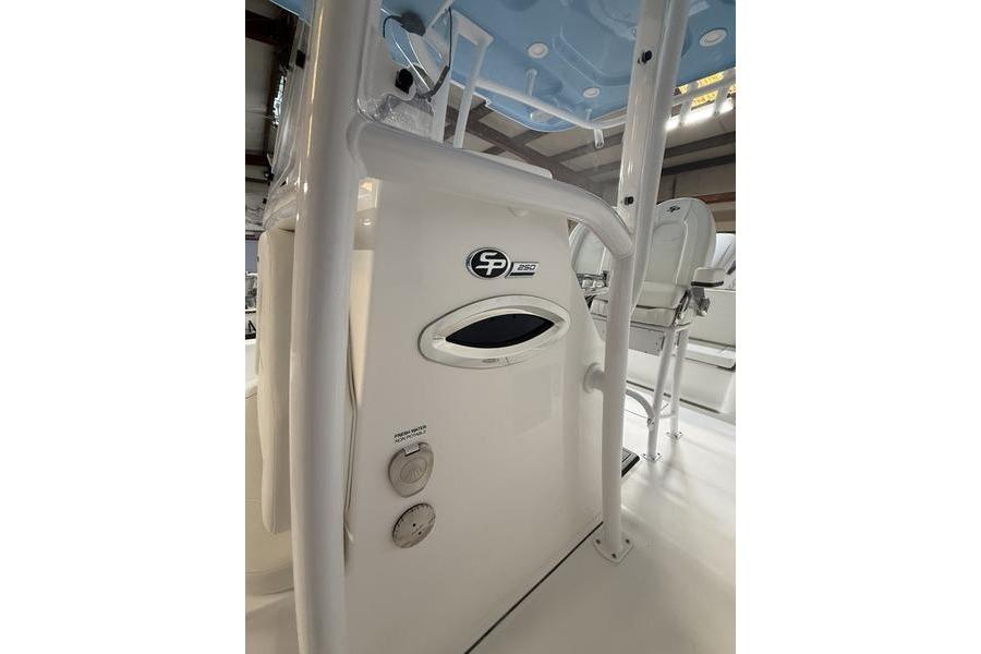2026 Sea Pro 250 Bay boat interior with seating and control panel.
