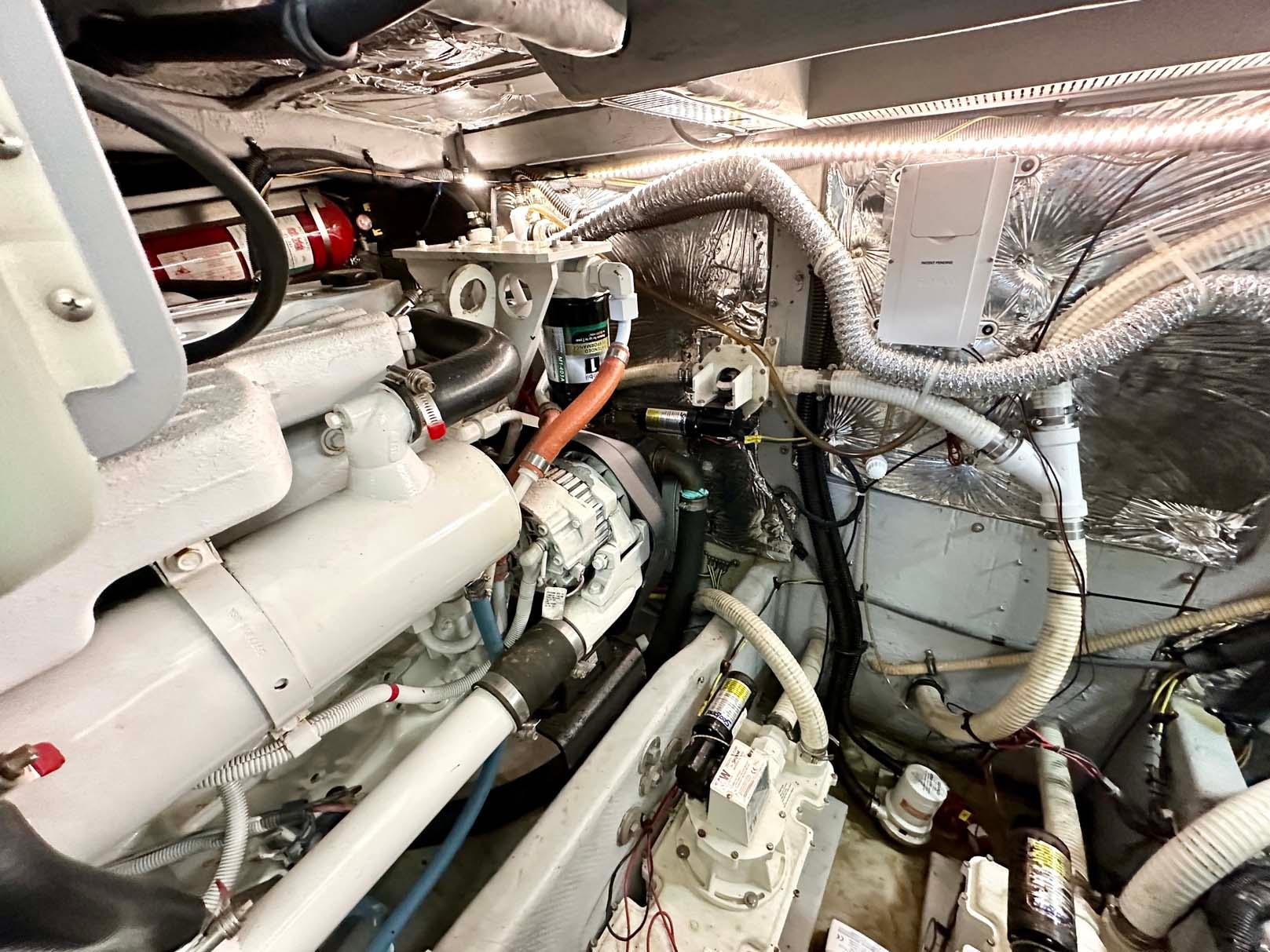 Engine room of a 2007 Meridian 411 Sedan, showcasing mechanical components and wiring.