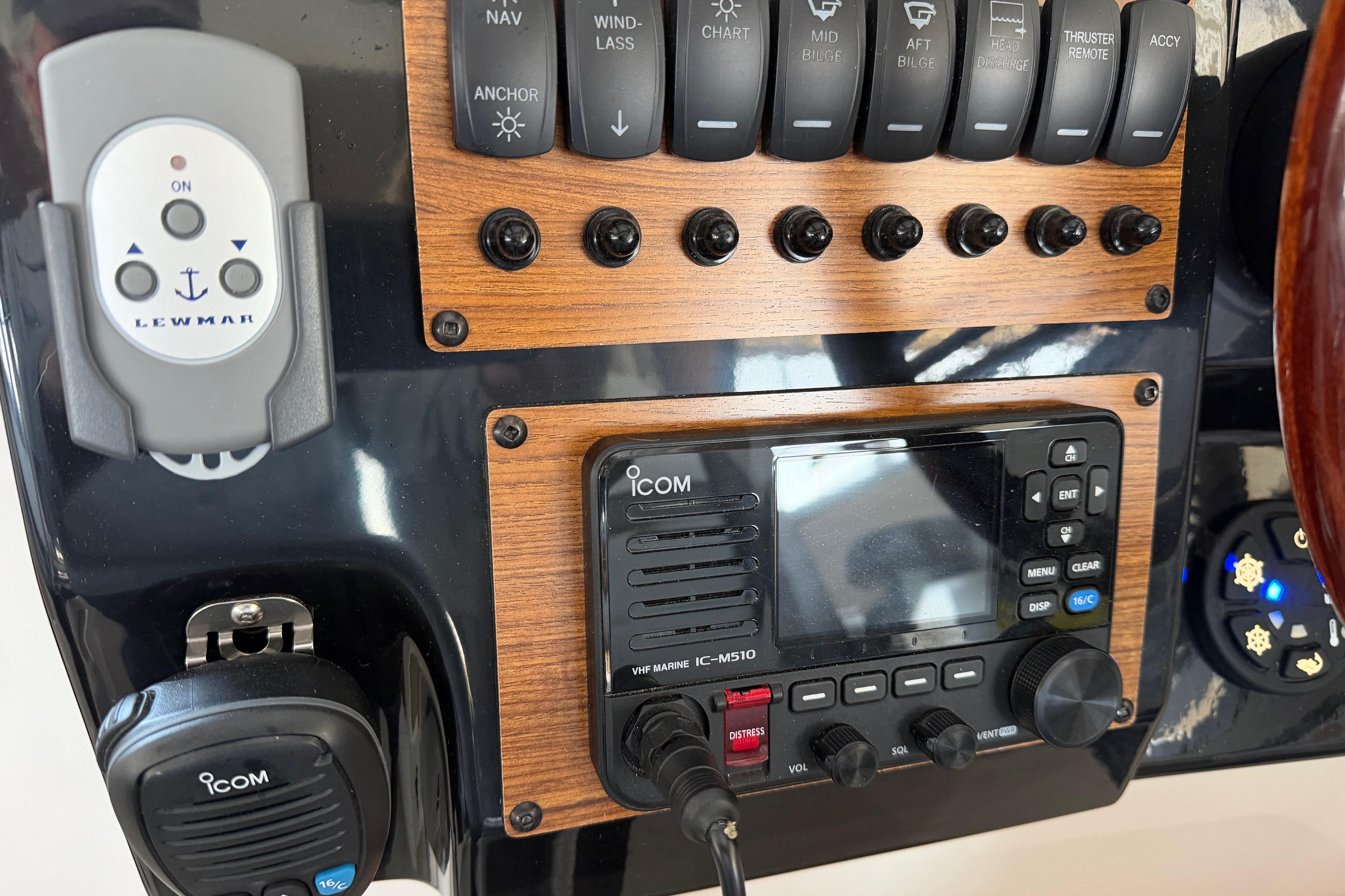Control panel of a 2023 Cutwater C-288 Coupe boat with Icom marine radio.