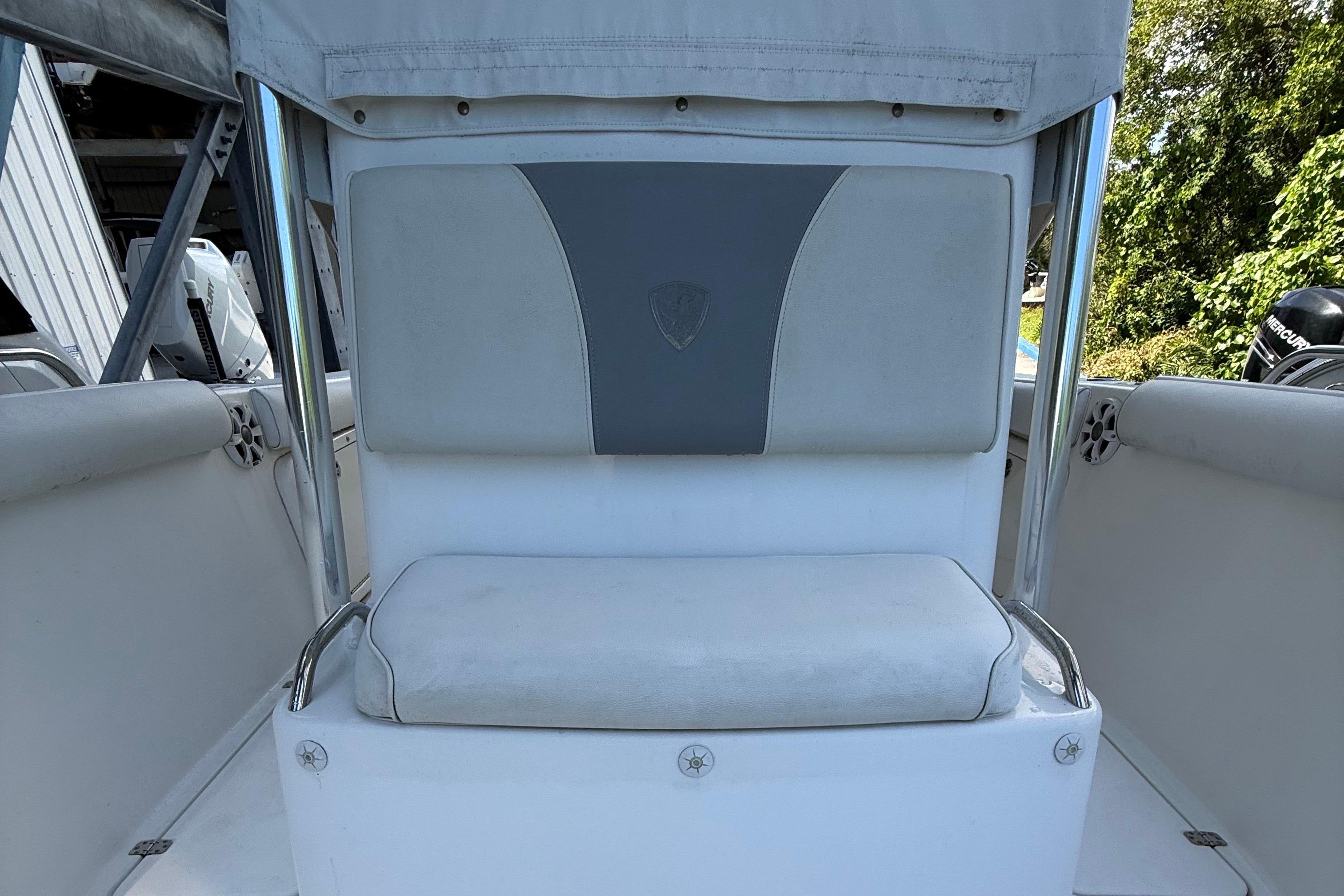 2008 Century 2901 Center Console boat seat with gray and white upholstery.