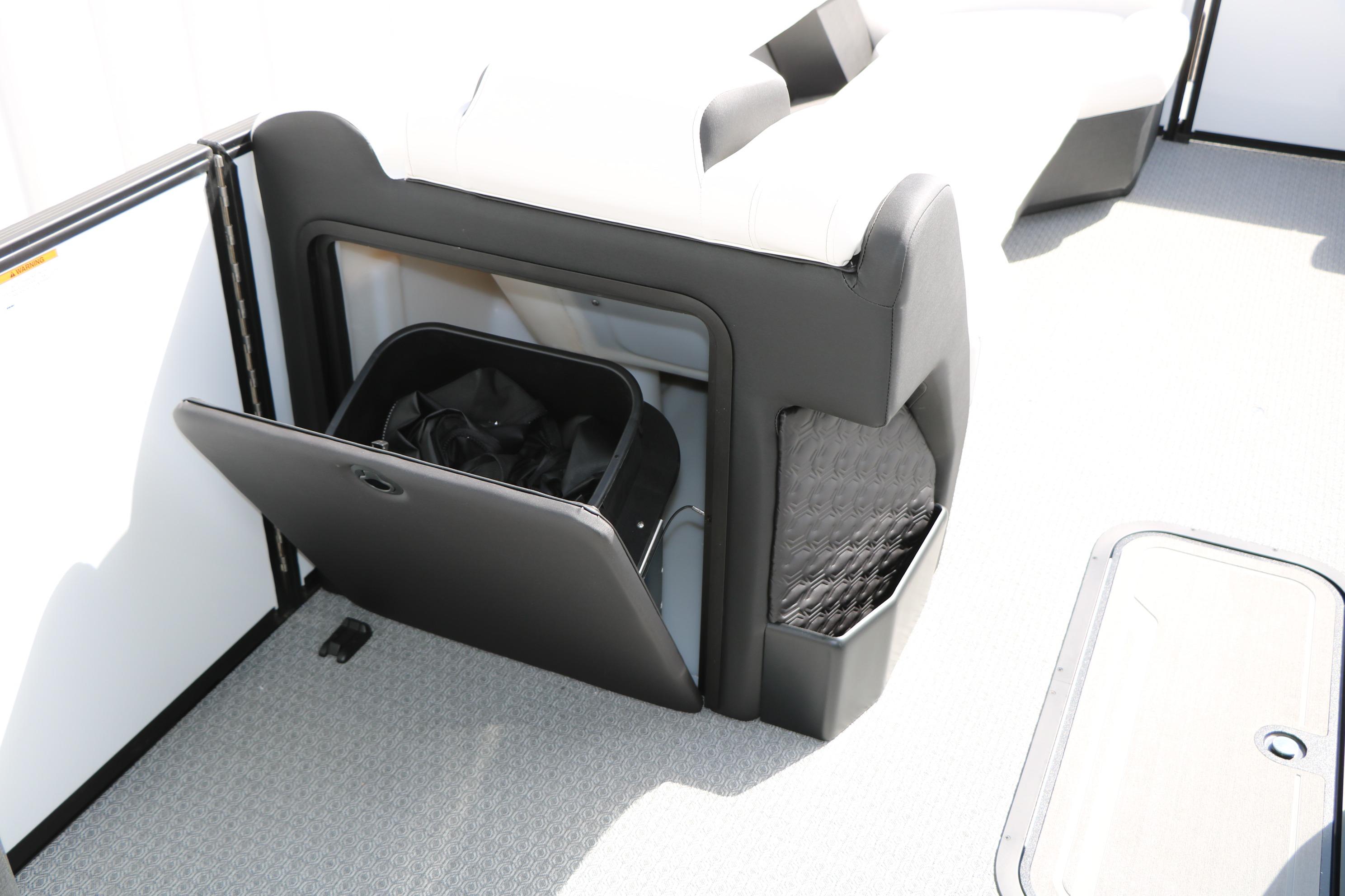 Storage compartment on 2026 Evotti 725 CS Tri-Toon boat, featuring sleek design and ample space.
