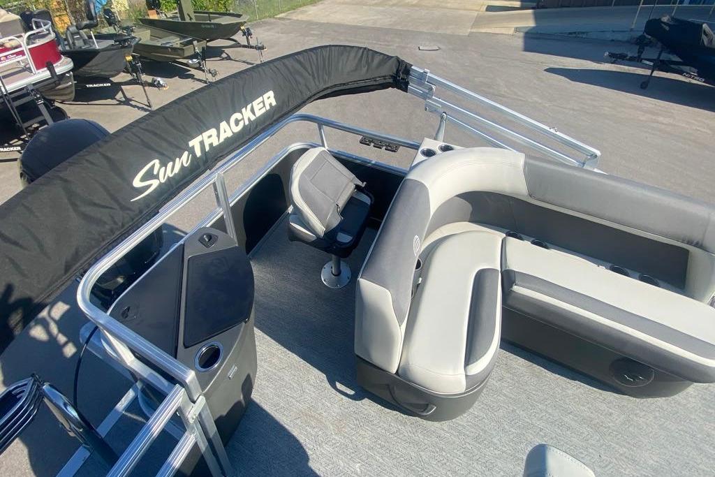2026 Sun Tracker Bass Buggy 18 DLX pontoon boat with seating and canopy.