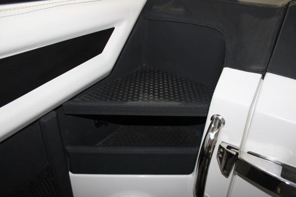 Interior detail of 2025 Cobalt R6, featuring sleek black and white design elements.