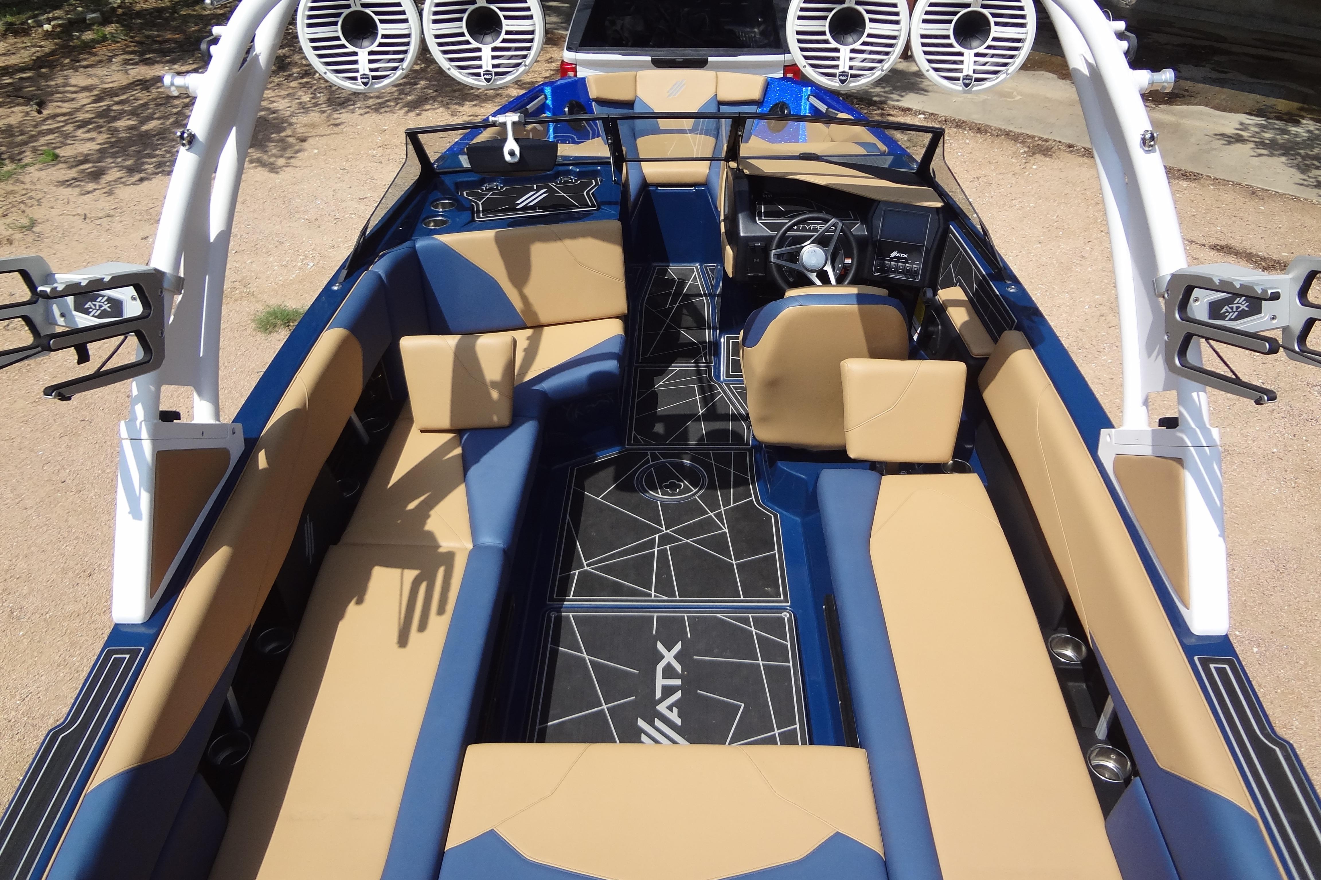 2022 ATX Surf Boats 24 Type-S interior with tan and blue seating, modern design.