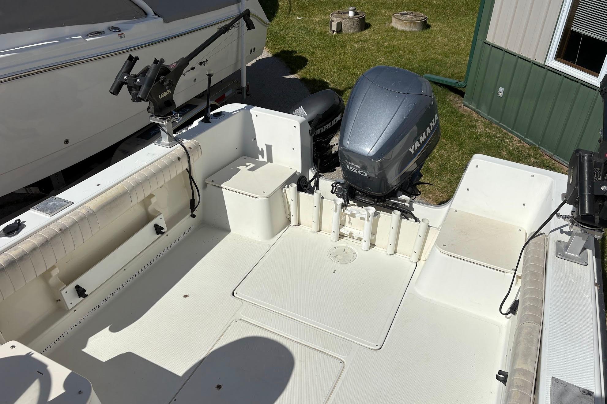 2002 Hydra-Sports 212 WA boat interior with Yamaha outboard motor and fishing rod holders.