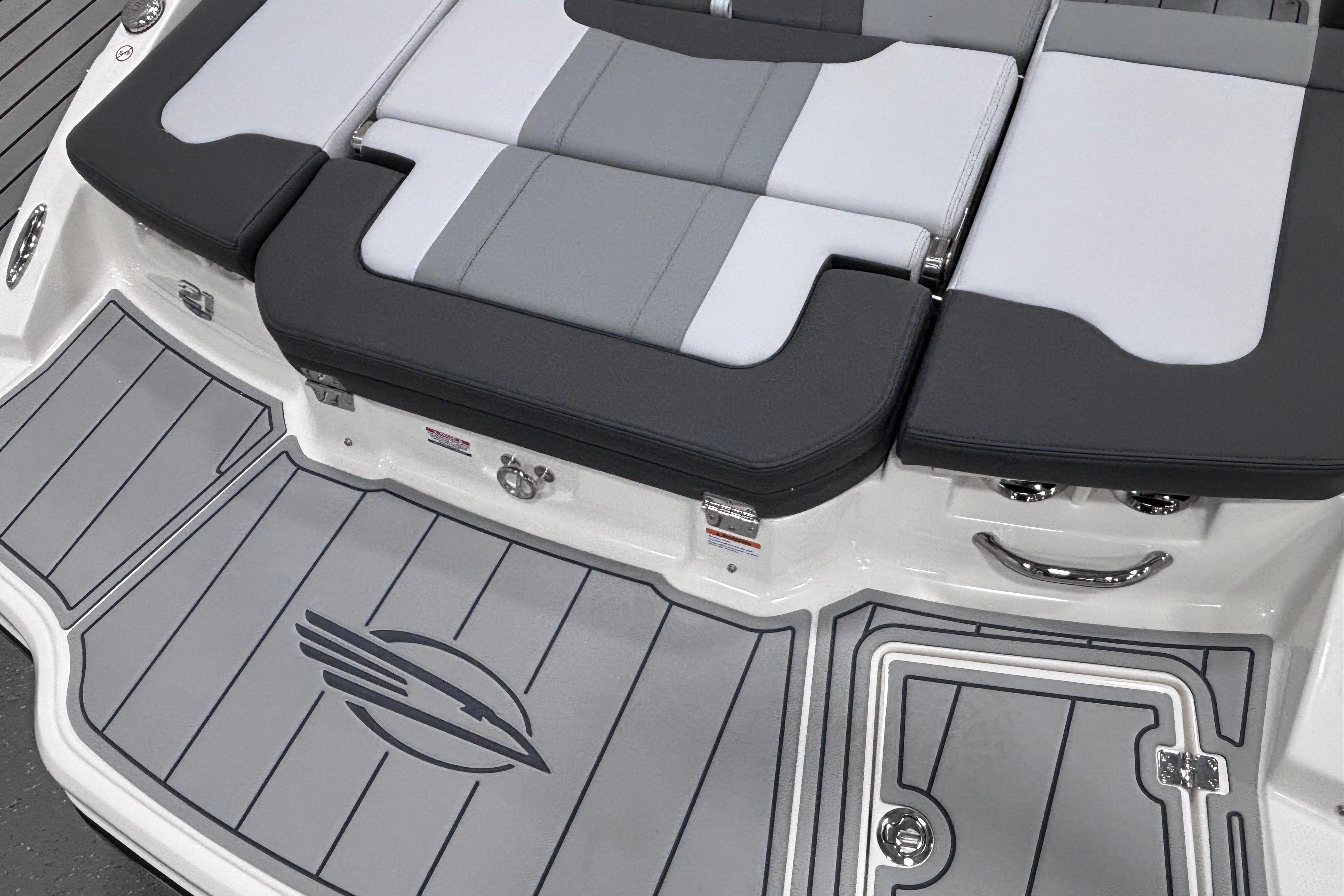 2026 Chaparral 21 SSi boat with sleek gray seating and deck design.