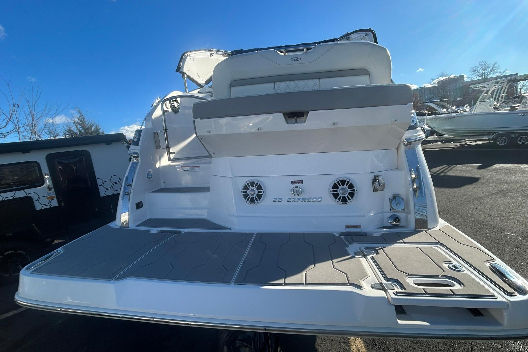 2024 Regal 28 Express boat rear view with spacious deck and seating.