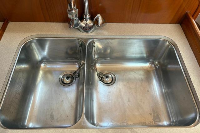 Stainless steel double sink in 2000 Beneteau Oceanis 321 yacht kitchen.