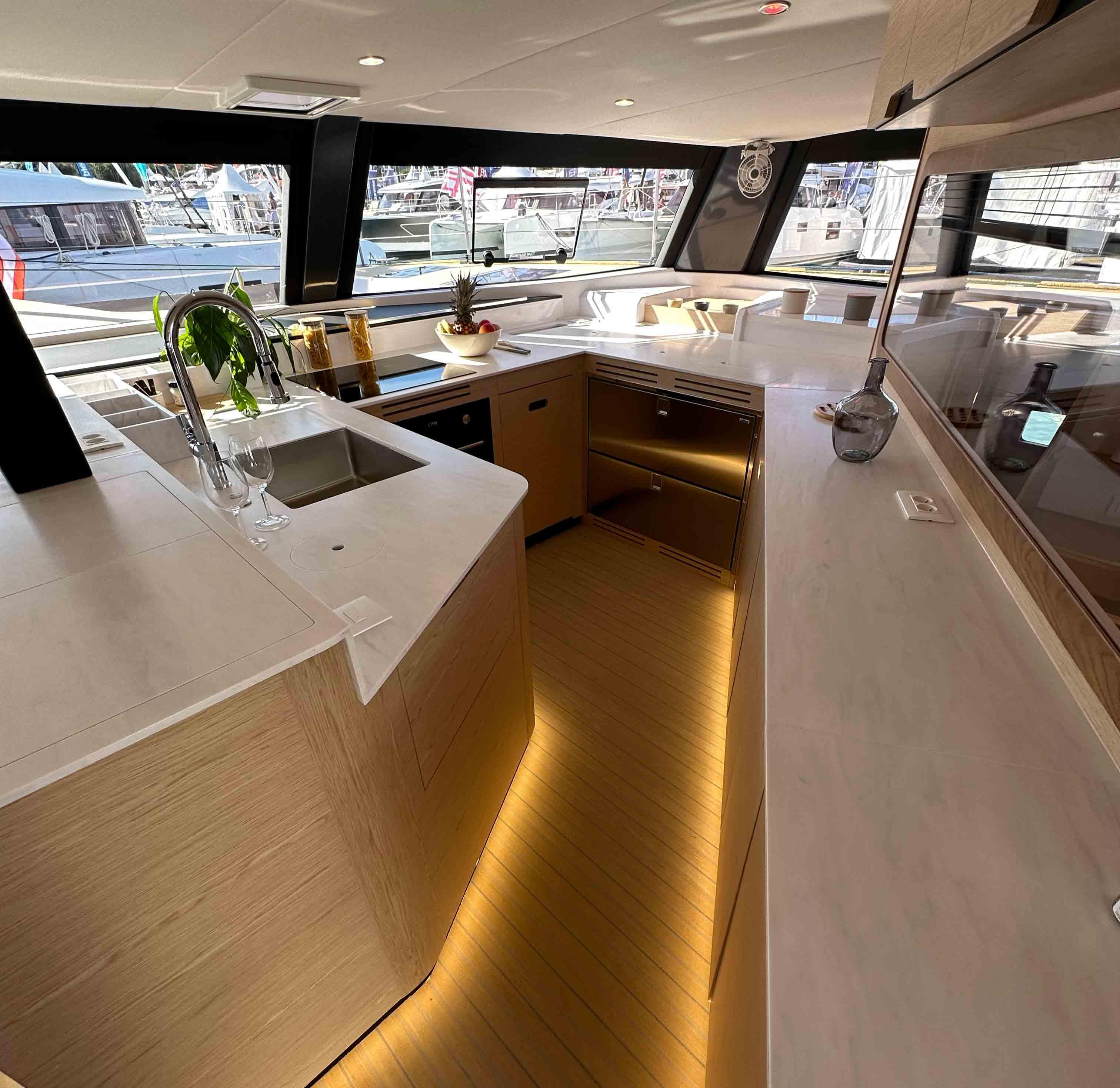 Luxurious NEEL 52 yacht interior kitchen with modern design and ambient lighting, 2025 model.