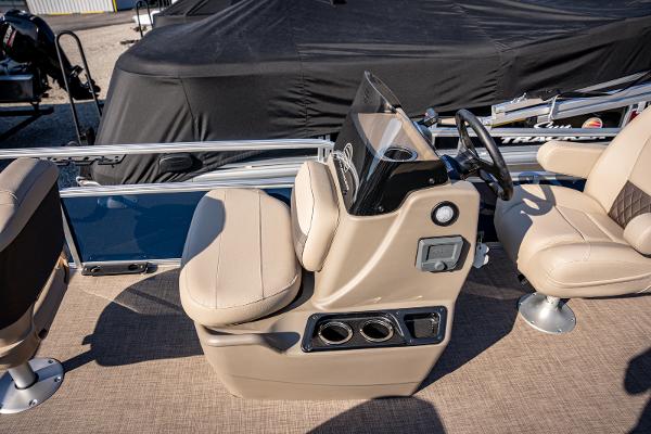 2025 Sun Tracker Bass Buggy 16 DLX boat interior with beige seating and steering console.