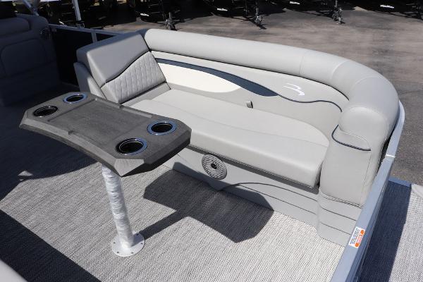 2024 Bennington 21 SSR pontoon boat interior with gray seating and table.