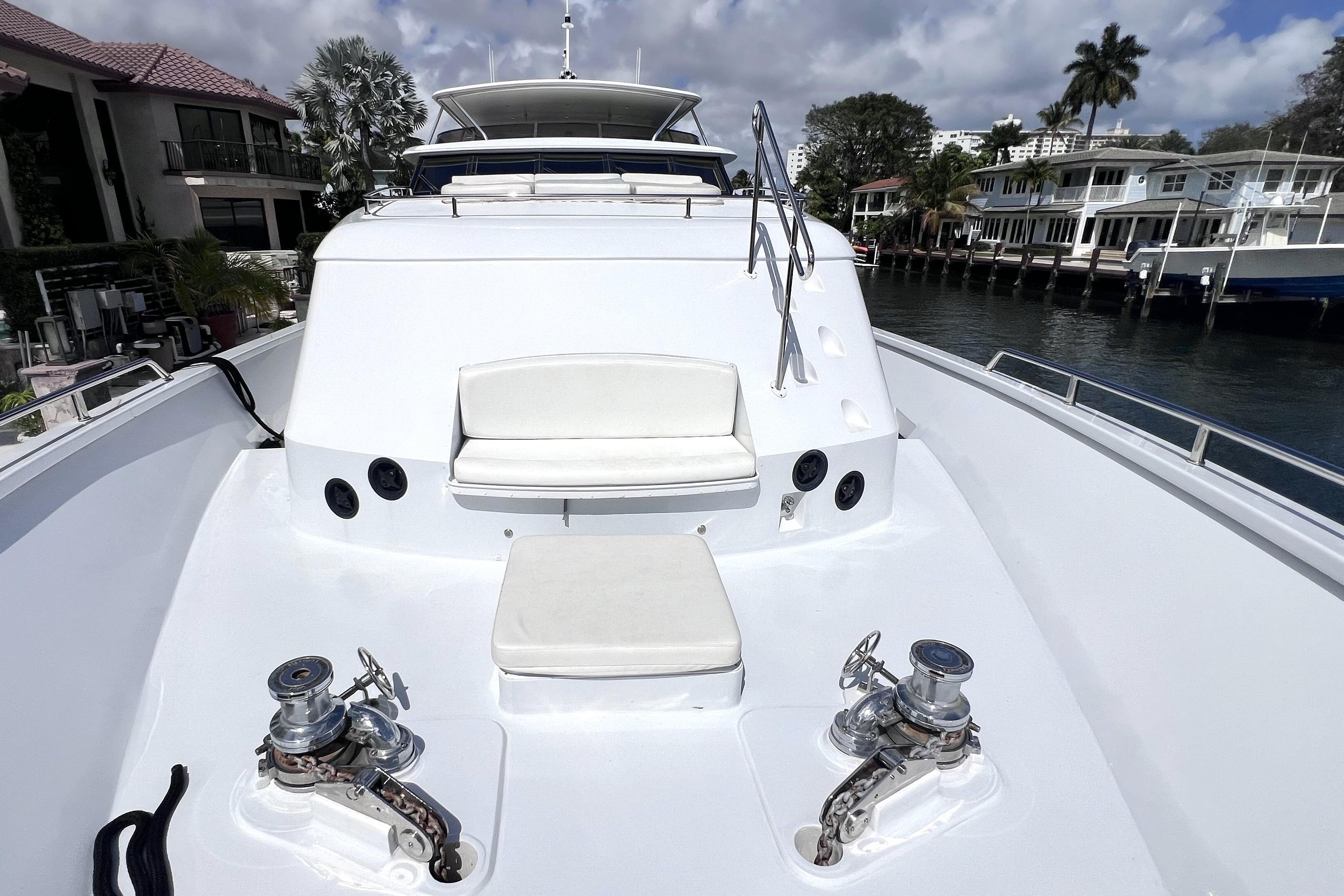 Luxurious 2002 Ocean Alexander 120 Megayacht deck with seating and winches.