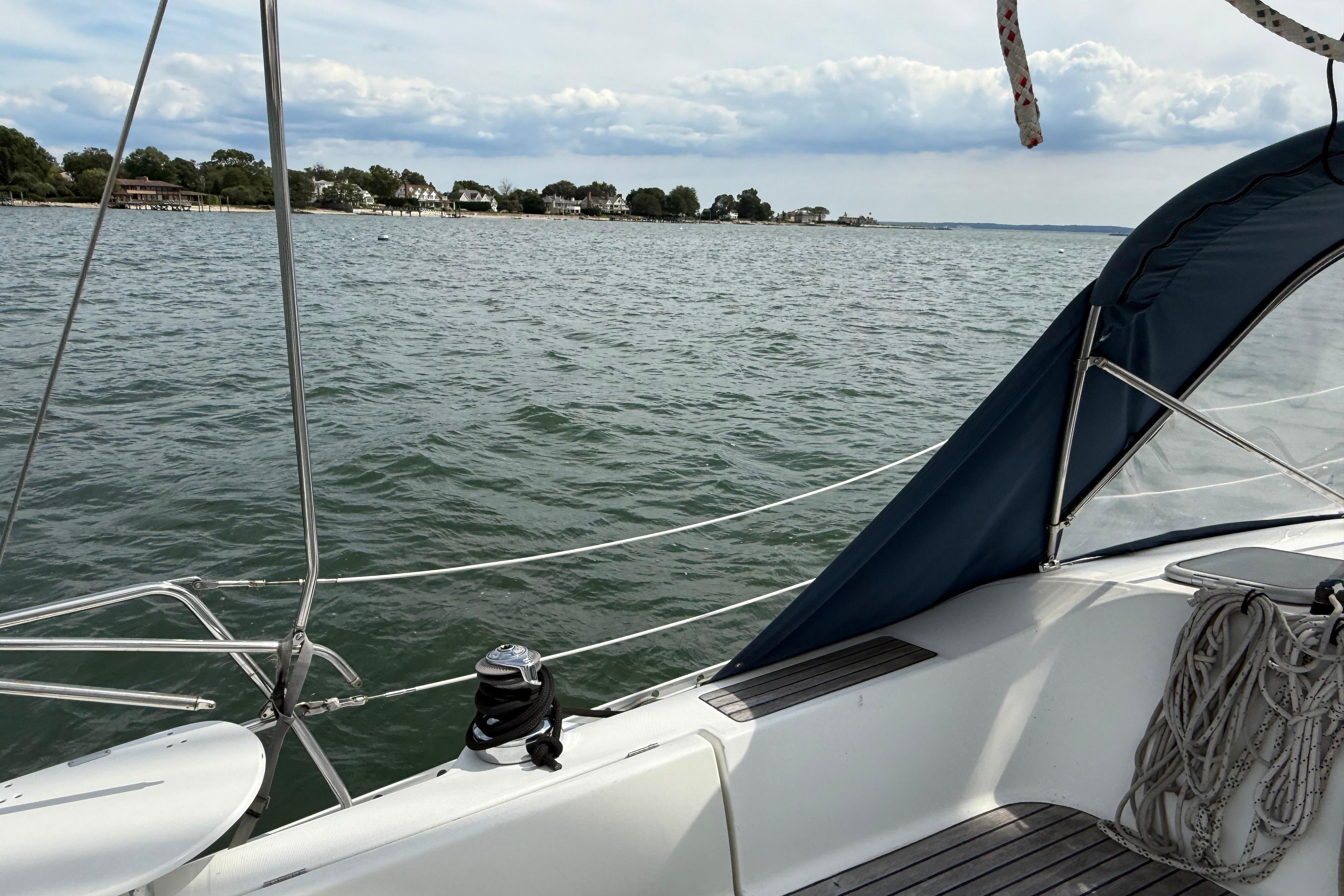 2003 Beneteau Oceanis Clipper 361 sailboat on calm waters with coastal view.