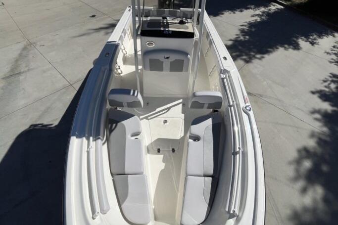 2025 Mako 214 Center Console boat with spacious seating and sleek design.