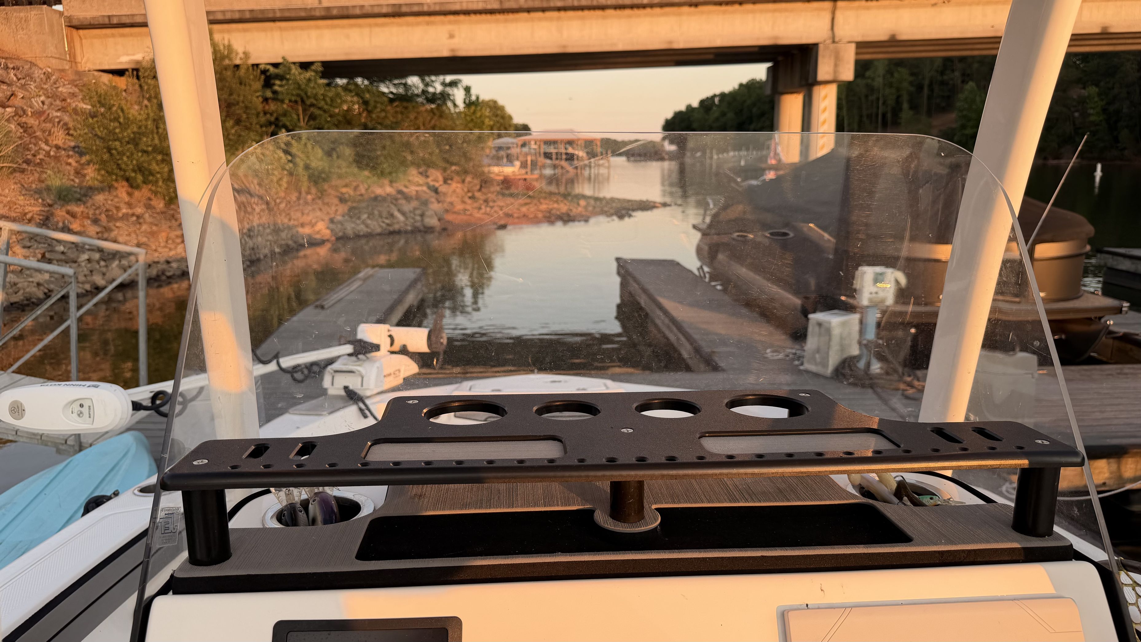 The image shows the cockpit of a 2019 Yamaha 190 FSH Sport boat on a calm river under a bridge.