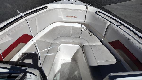 1999 Chaparral 2130 SS boat interior with white and red seating.