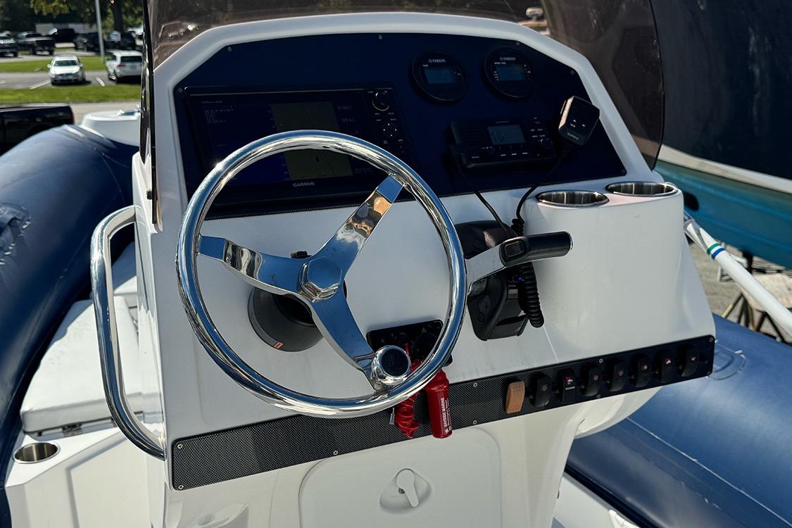 Control panel of 2020 AB Inflatables Oceanus 21 VST boat with steering wheel and gauges.