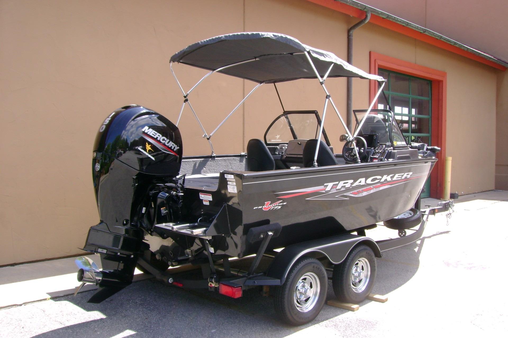 2023 Tracker Pro Guide V-175 WT boat with Mercury engine, parked on a trailer.