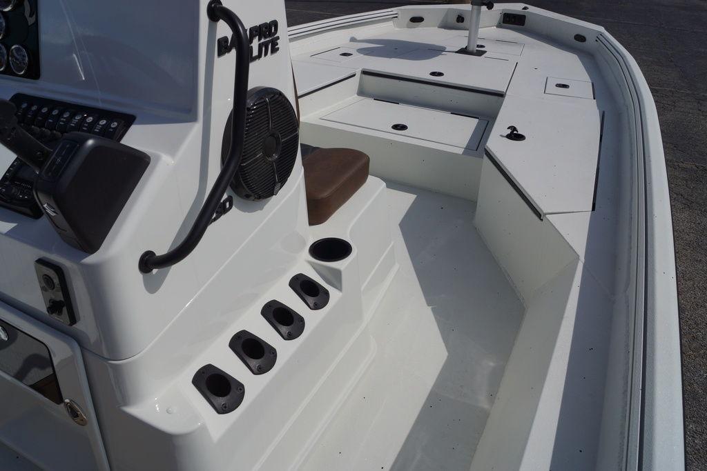 2026 Excel 230 Bay Pro Elite boat interior with console and seating.