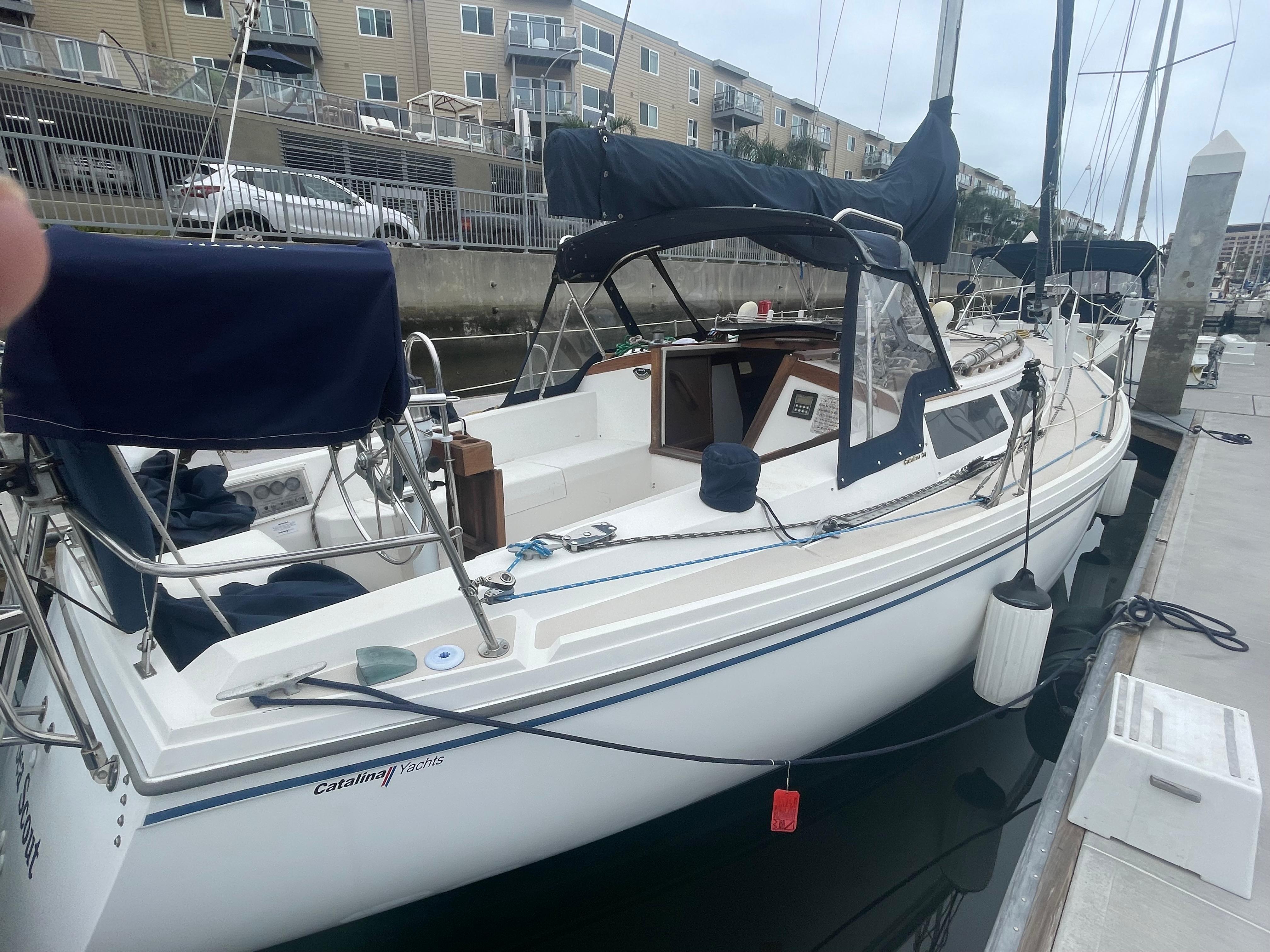 1987 Catalina 34 MkII sailboat docked at marina.