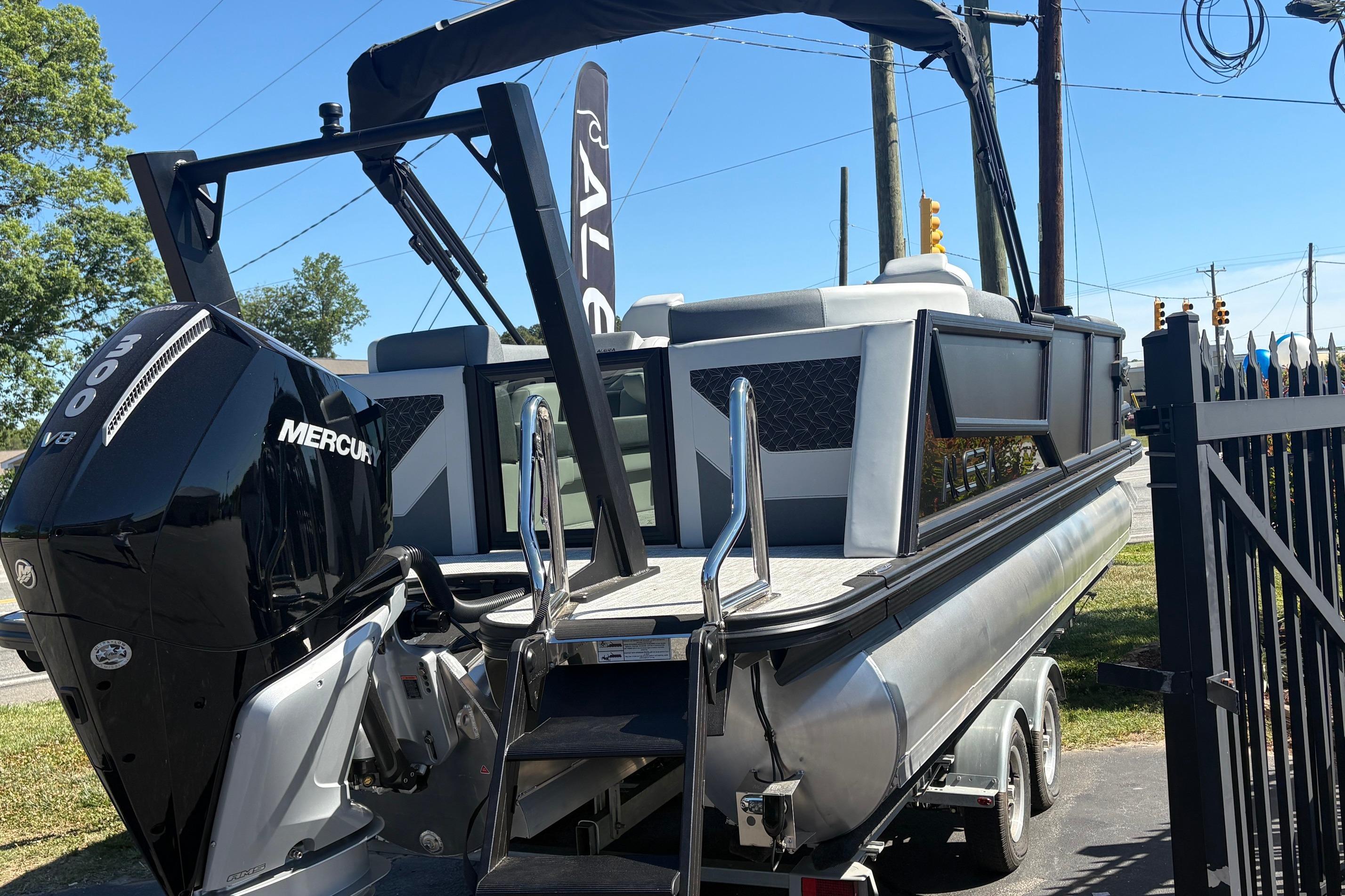 2026 Alera 23Q pontoon boat with Mercury 300 V8 engine on trailer.
