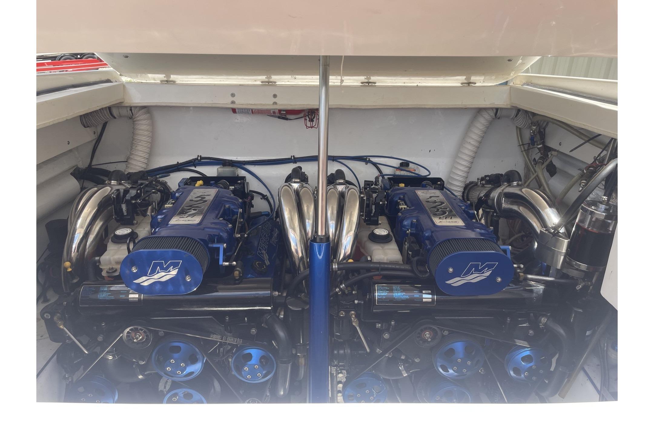 Twin engines in a 2006 Sonic 386 boat, showcasing powerful marine performance.