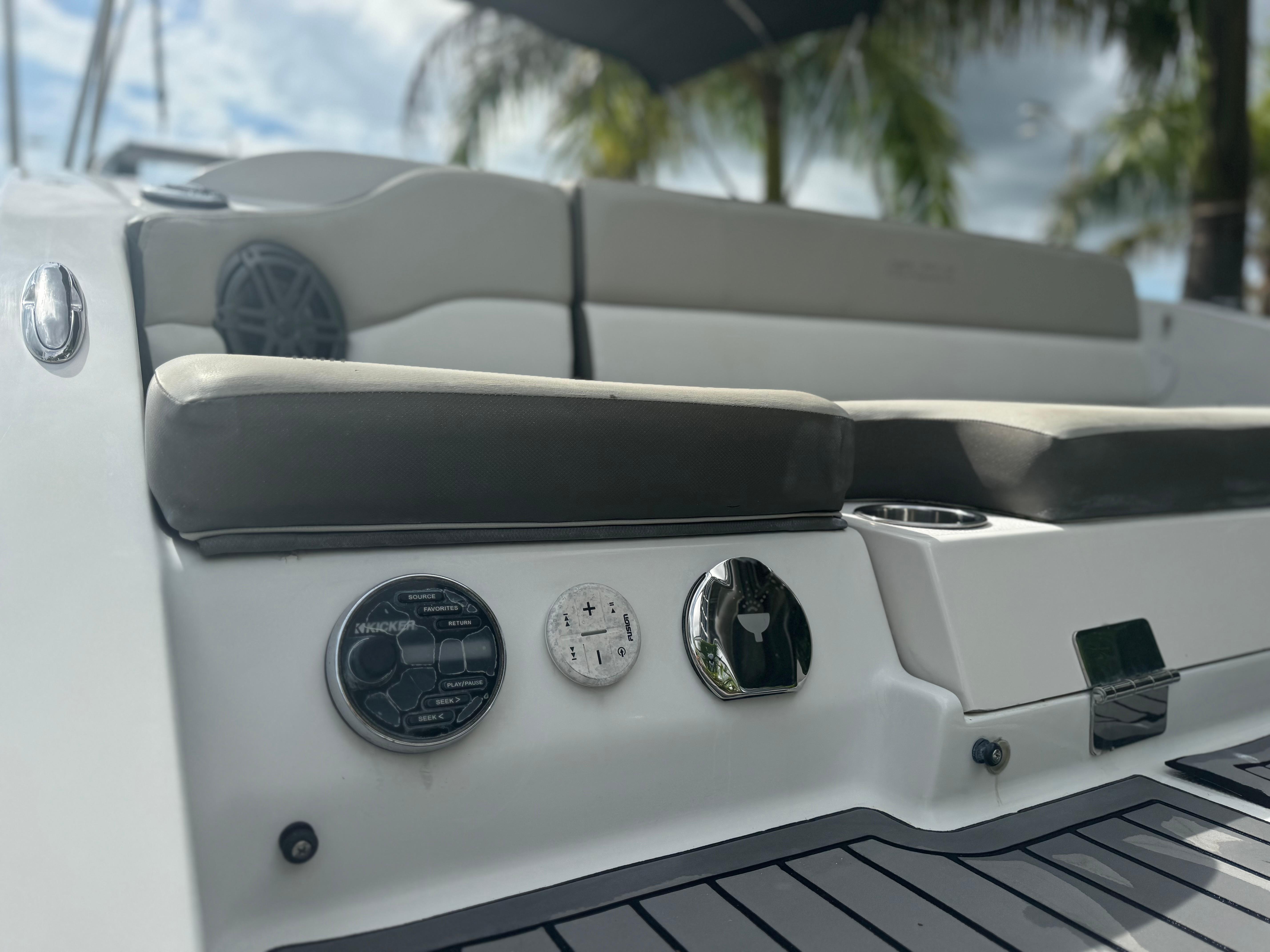 2017 Starcraft 230 OB SCX EXT boat interior with seating and control panel.