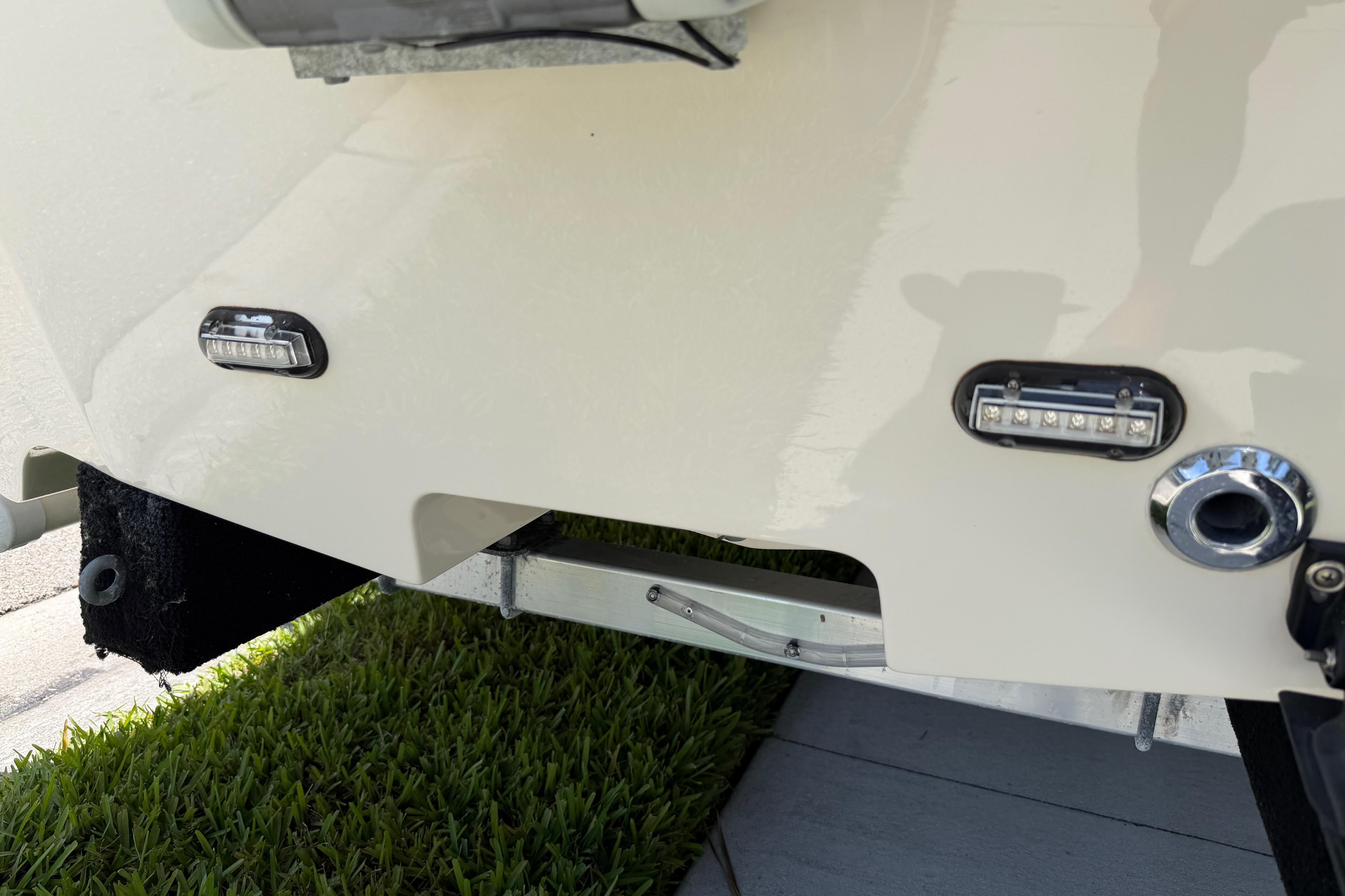 2023 Carolina Skiff 21 LS boat stern with LED lights and trailer detail.