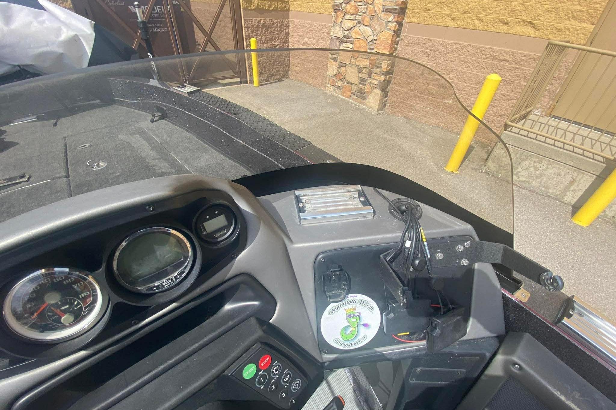 2017 Ranger 621FS Fisherman boat dashboard with gauges and controls in a parking area.