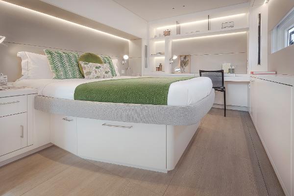 Luxurious bedroom interior of 2025 Lagoon SIXTY 5 yacht with modern design and elegant furnishings.