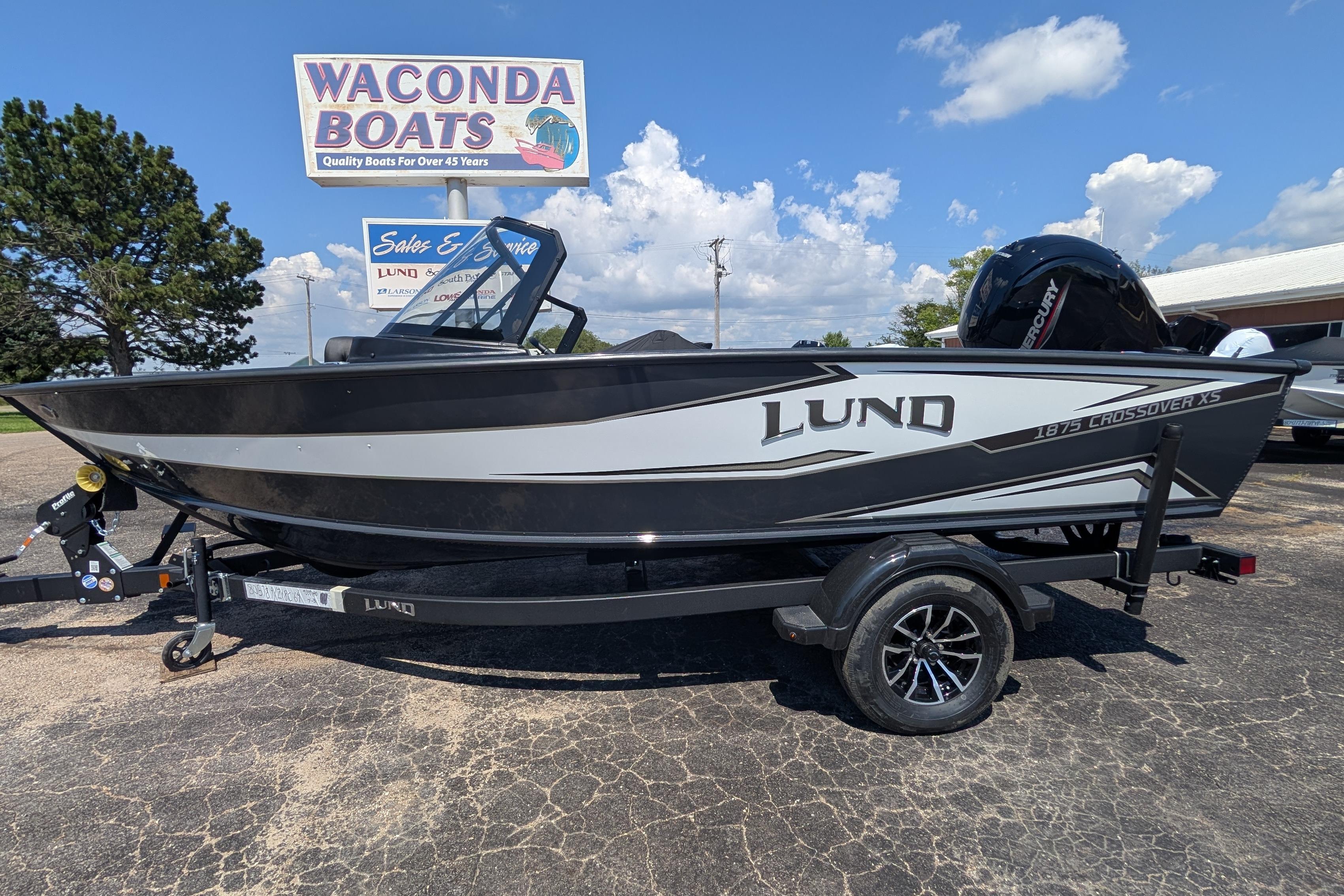 2026 Lund 1875 Crossover XS boat on trailer at Waconda Boats dealership.