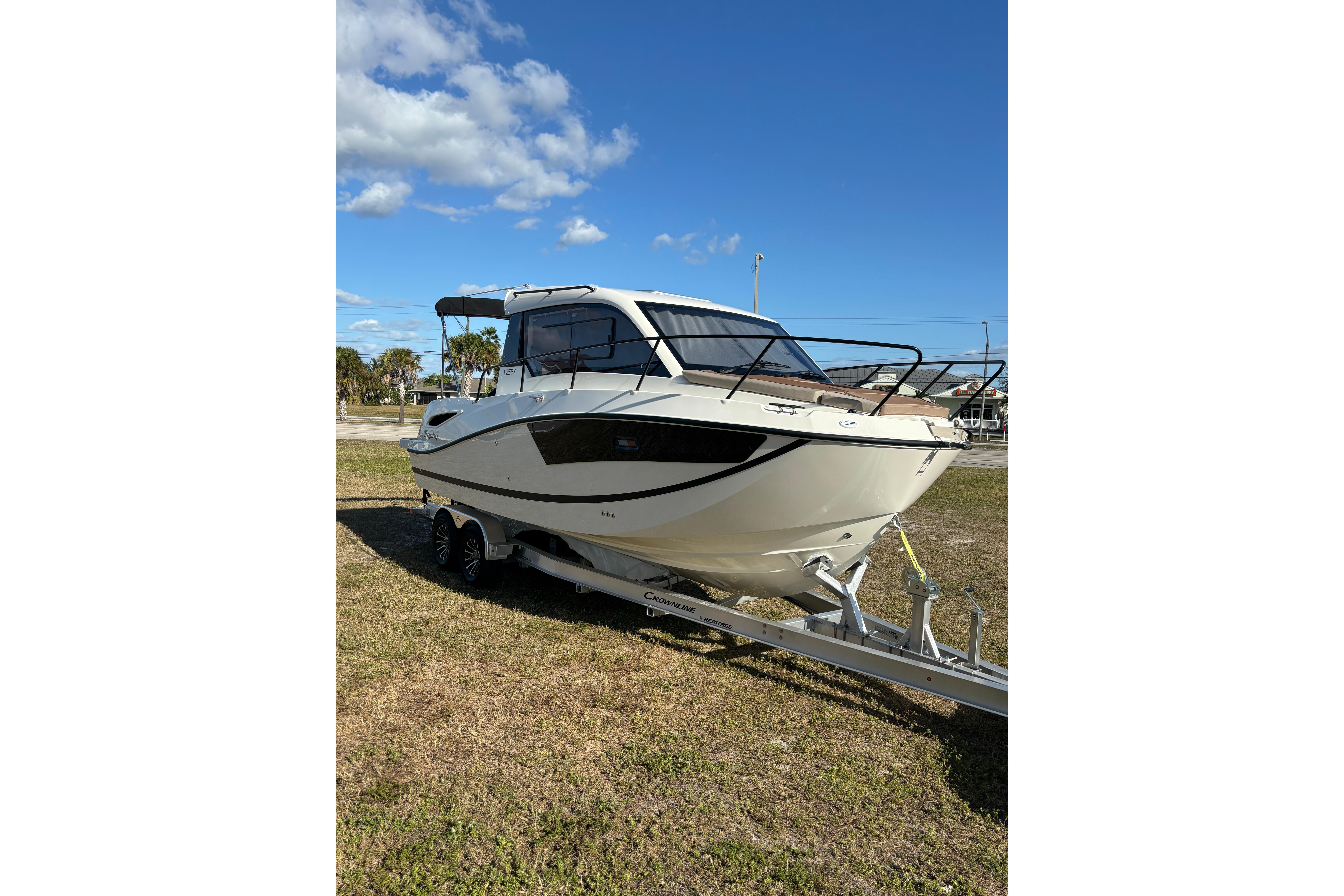 2026 Trophy T 25 Explorer boat on trailer under clear blue sky.