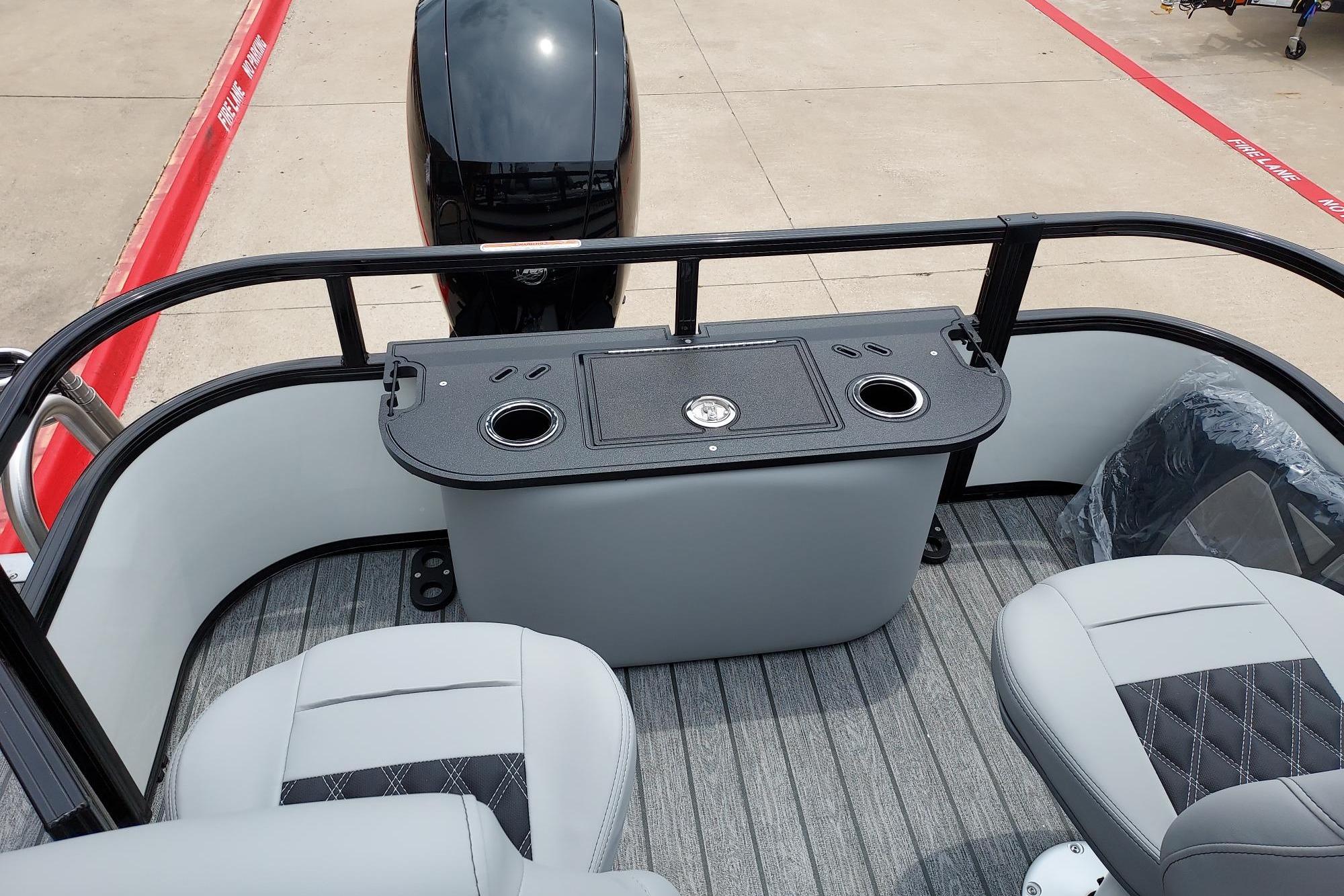 2026 Ranger 220F boat interior with seating and motor, featuring modern design elements.