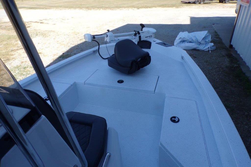 2026 Xpress H20B Bay boat deck with seating and trolling motor.