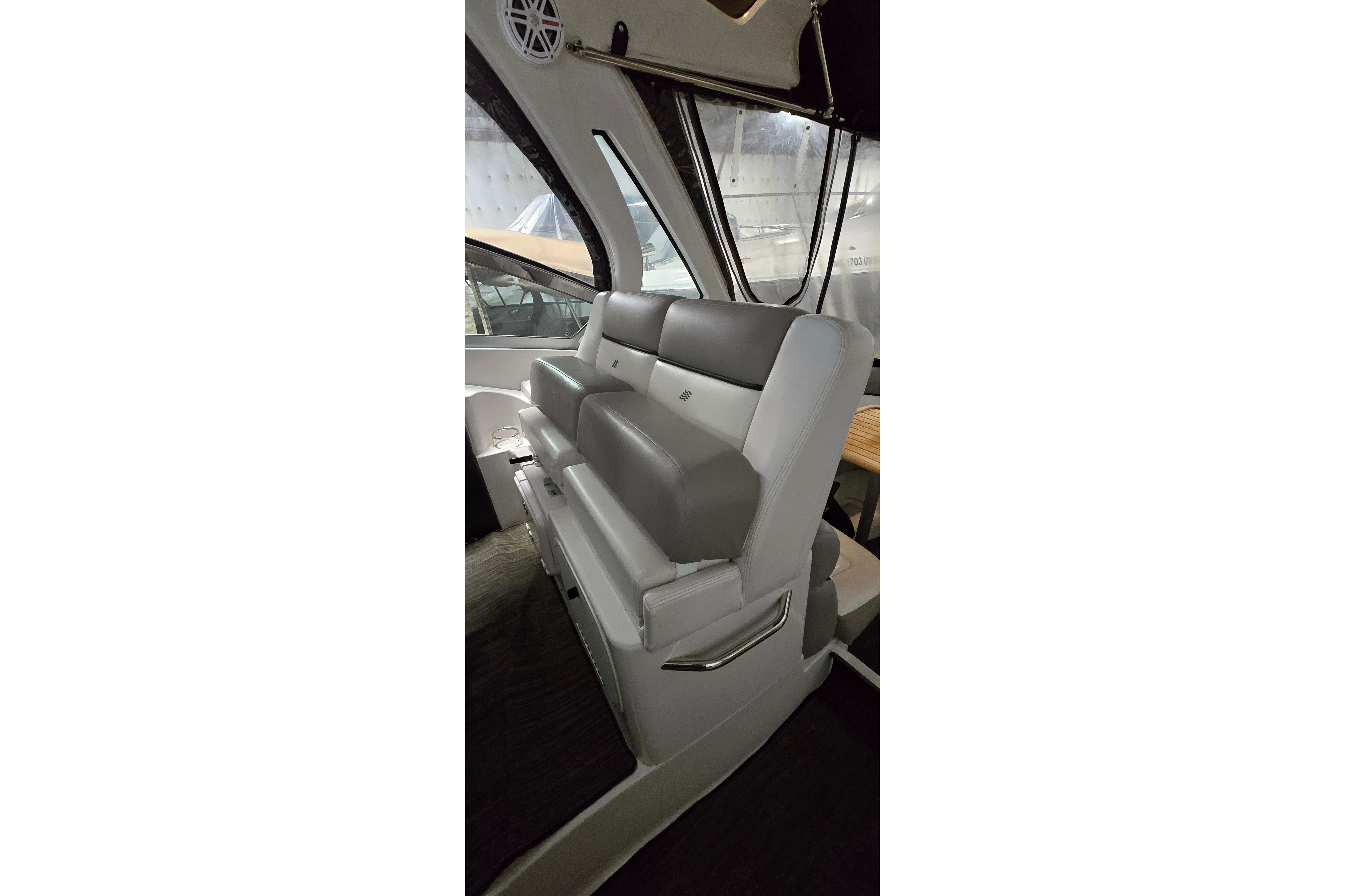 2018 Four Winns V355 boat interior with gray seating and large windows.