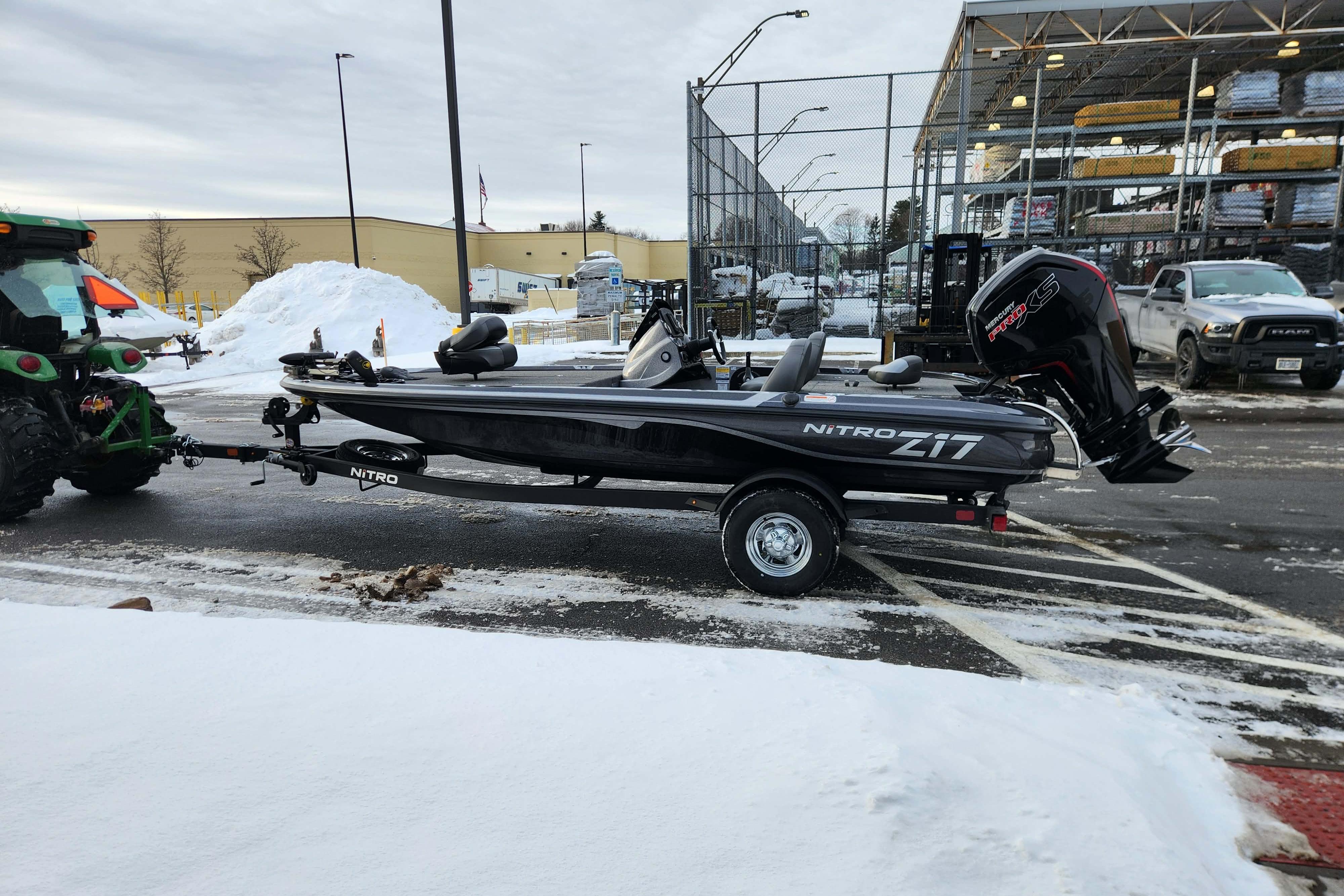 2026 Nitro Z17 boat on trailer in snowy parking lot.