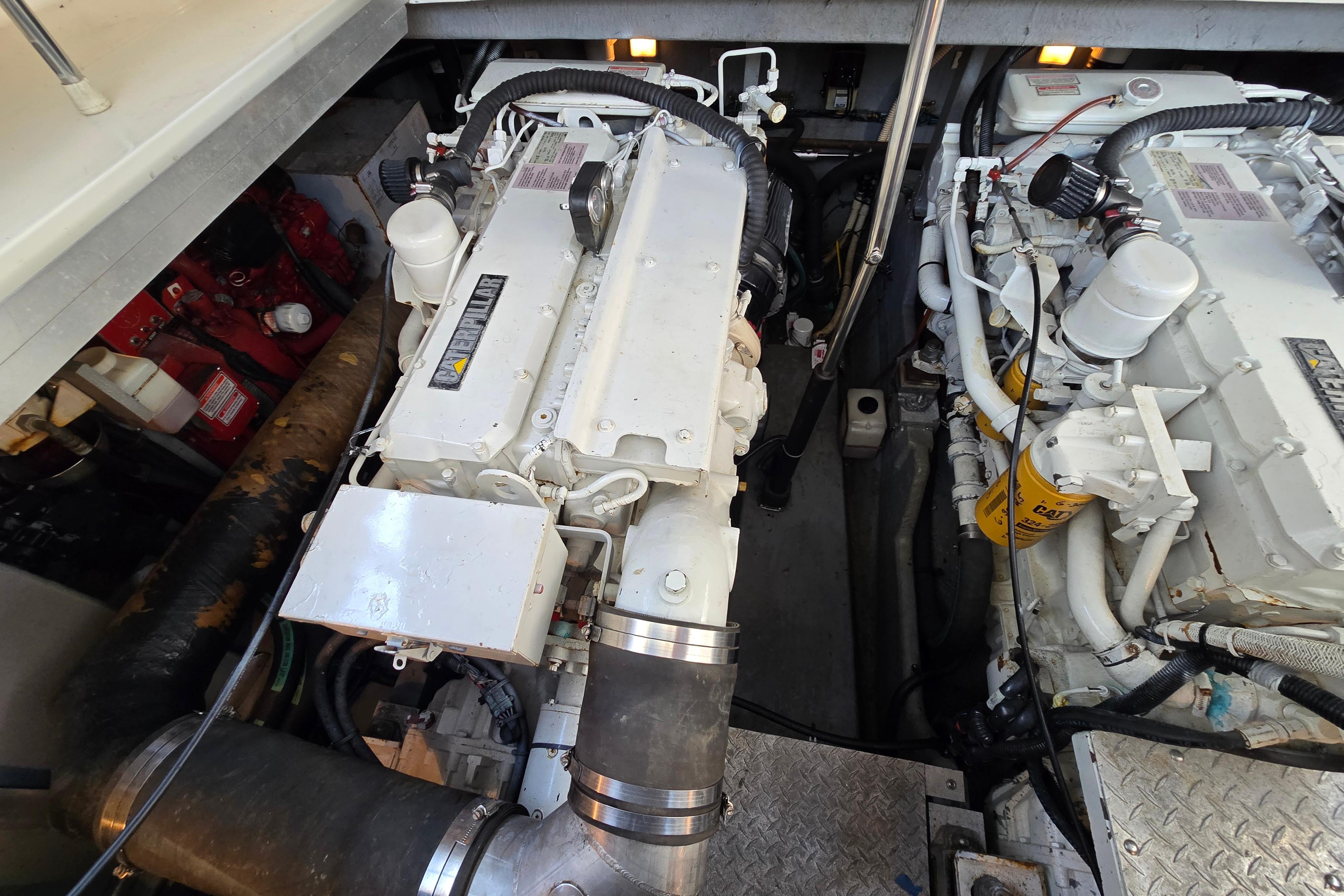 Engine room of a 1999 Sea Ray Sundancer 400, showcasing dual marine engines.