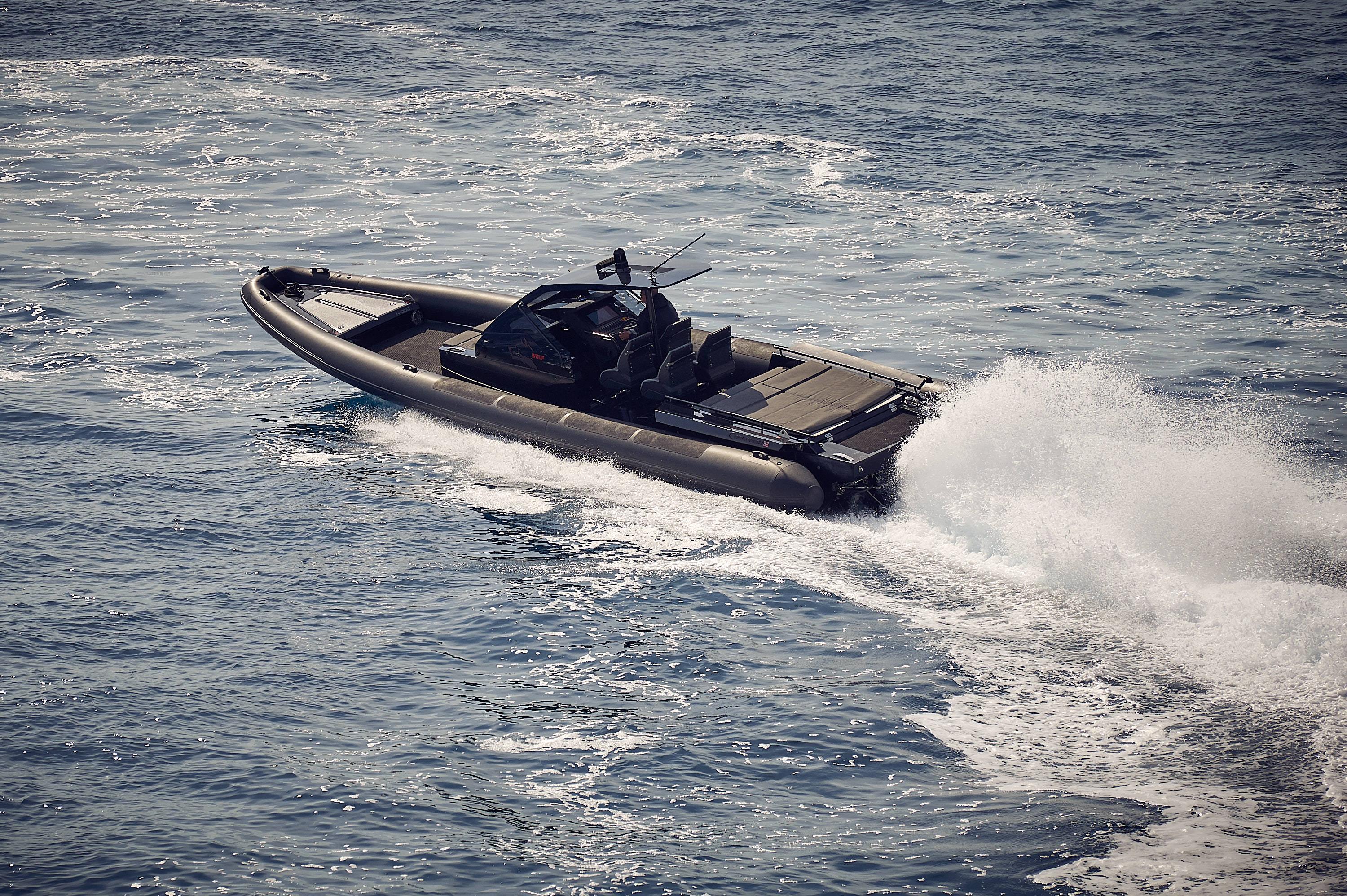 2016 Goldfish 38 Supersport boat speeding on open water.