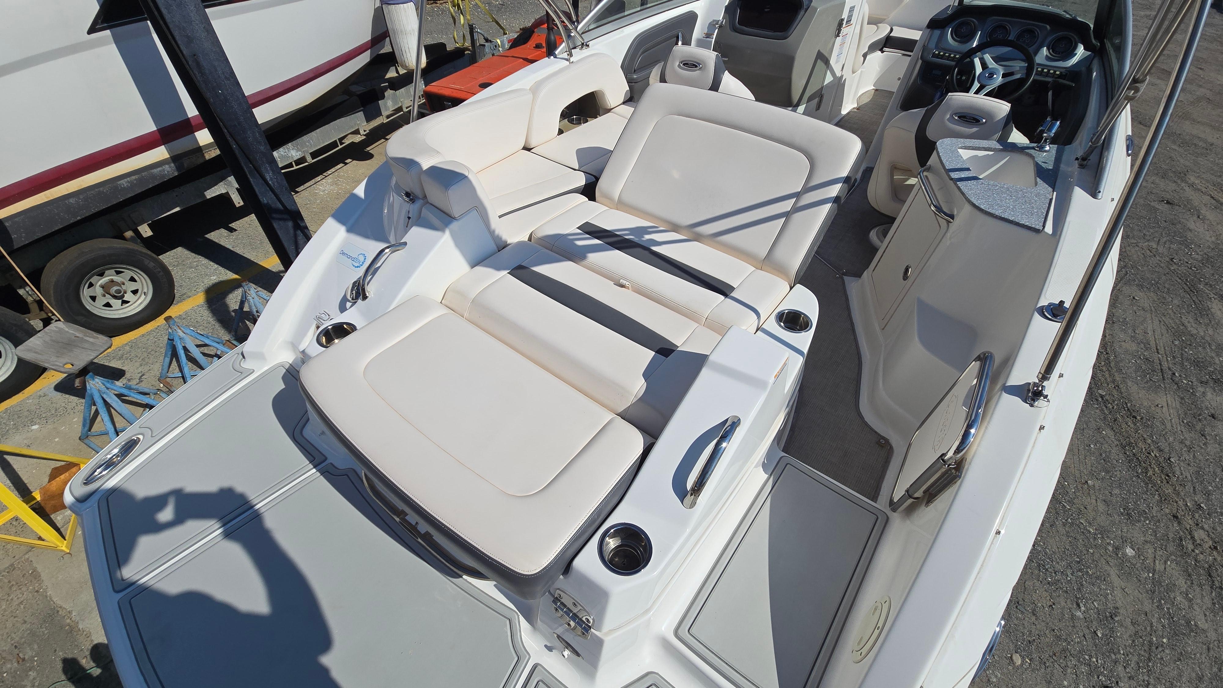 2018 Chaparral 224 Sunesta boat interior with spacious seating and modern dashboard.