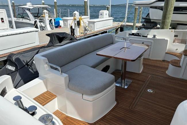 Azimut Fly 53 yacht 2013 model, featuring a spacious deck with seating and table.