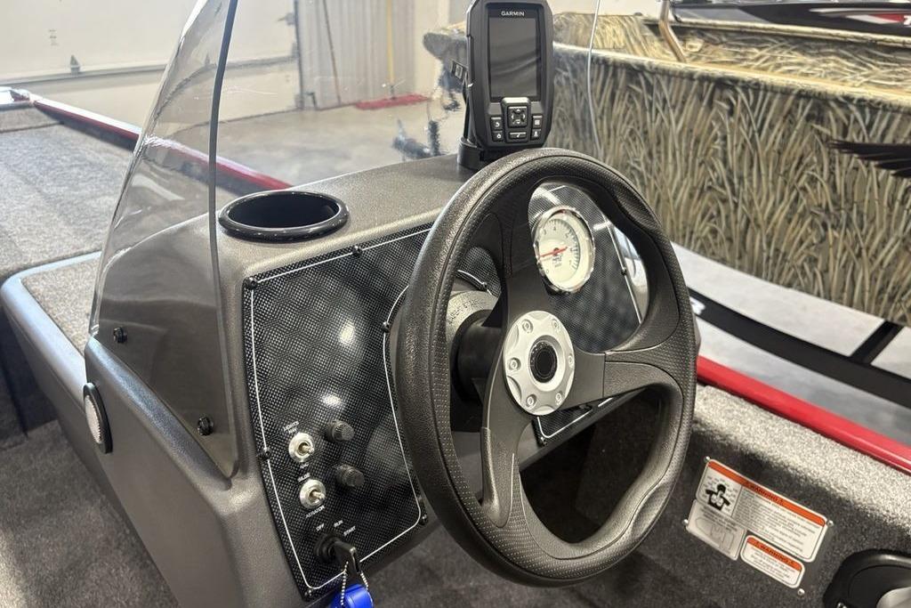 Steering console of 2026 Tracker Bass Tracker Classic XL boat with Garmin device.